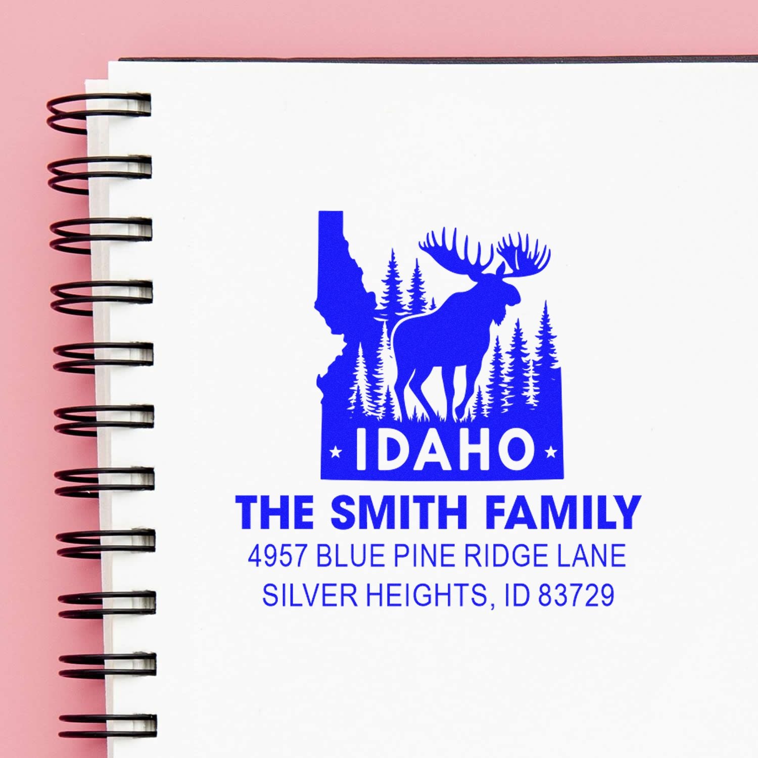 Custom Idaho family return address rubber stamp with moose, pine trees, and Smith family address.