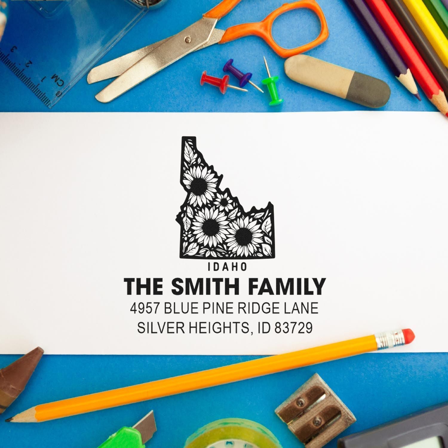 Custom Idaho floral address rubber stamp for The Smith Family with personalized return address and state design.