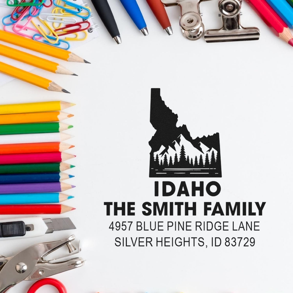 Custom Idaho family return address rubber stamp with mountain and forest design for personalized mail and packaging.