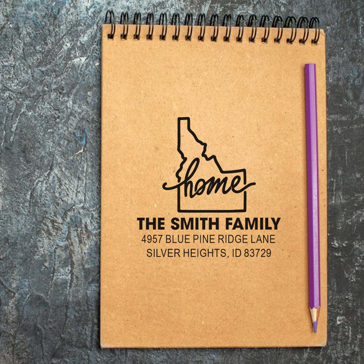 Personalized Idaho home address rubber stamp with family name, street address, and custom home design for stationery.
