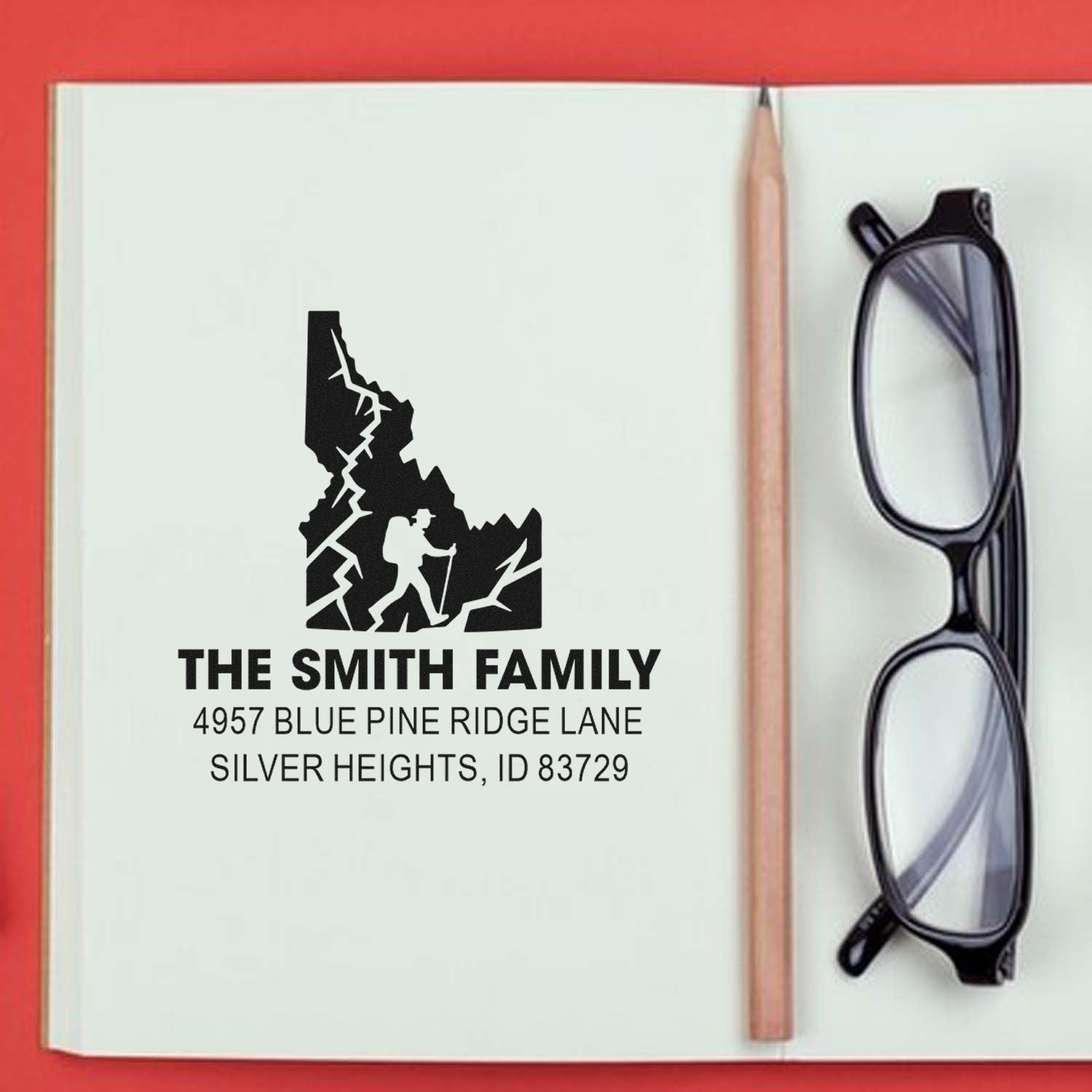 Custom family address rubber stamp with Idaho hiker design for The Smith Family return address.
