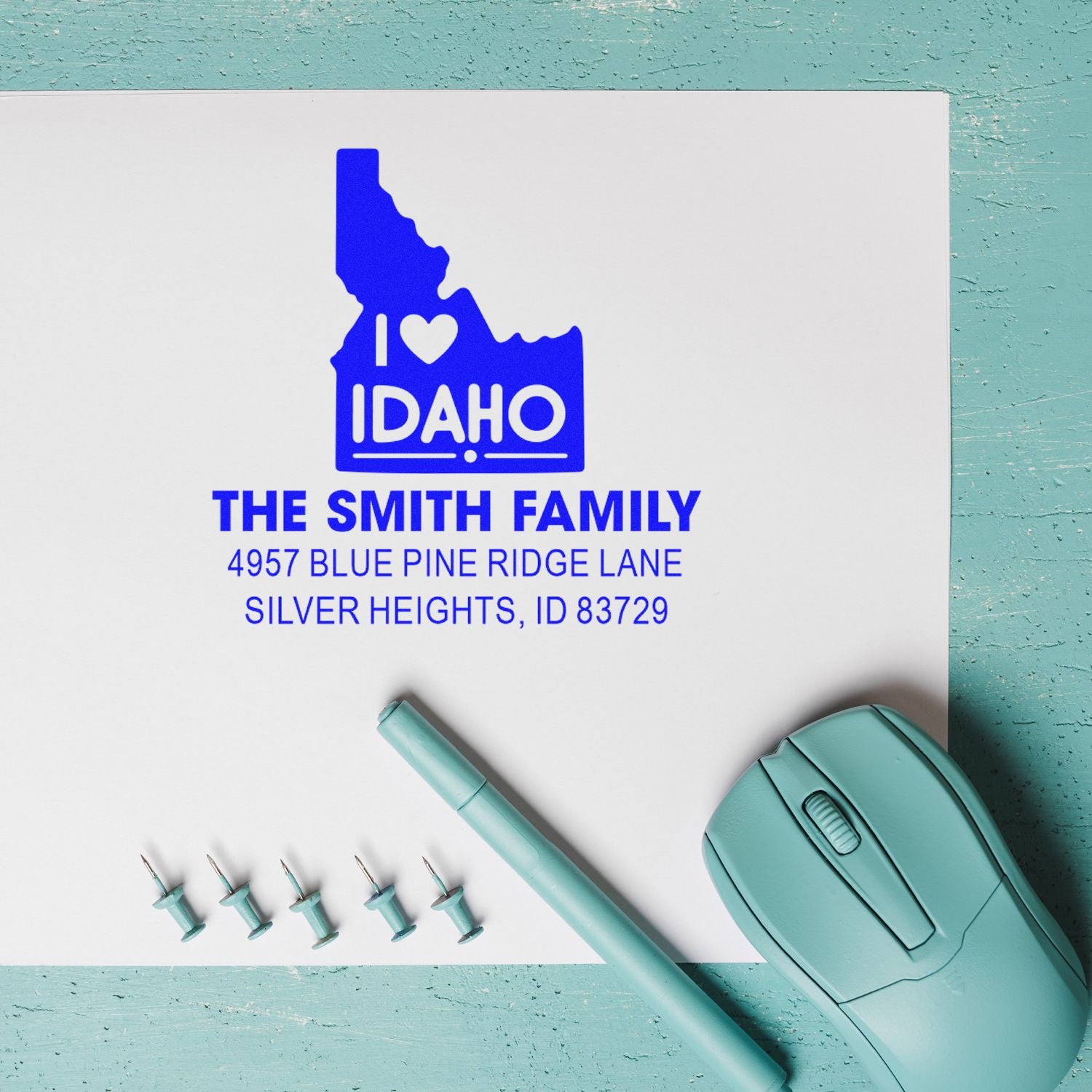 Personalized rubber address stamp for The Smith Family with Idaho state design, heart icon, and Silver Heights, ID return address.