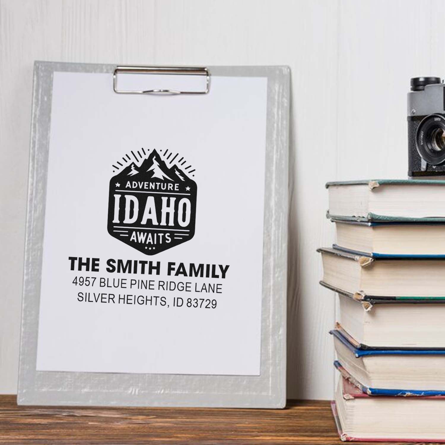 Custom rubber stamp with Adventure Idaho Awaits design and personalized family address for mailing and stationery.