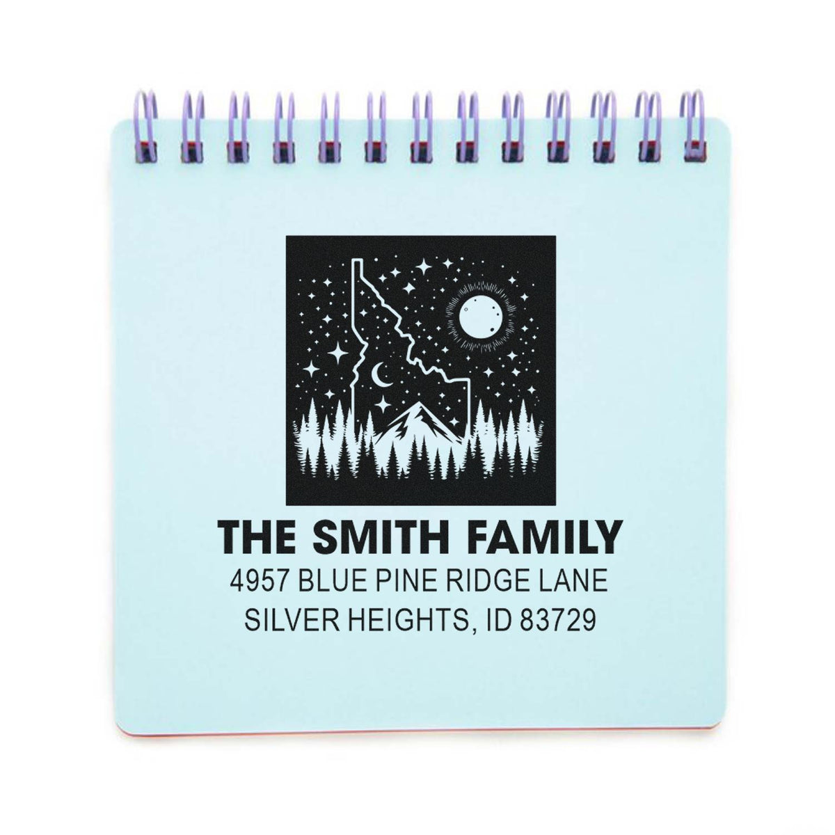 Custom family address rubber stamp with mountain and forest design for personalized mailing and stationery.