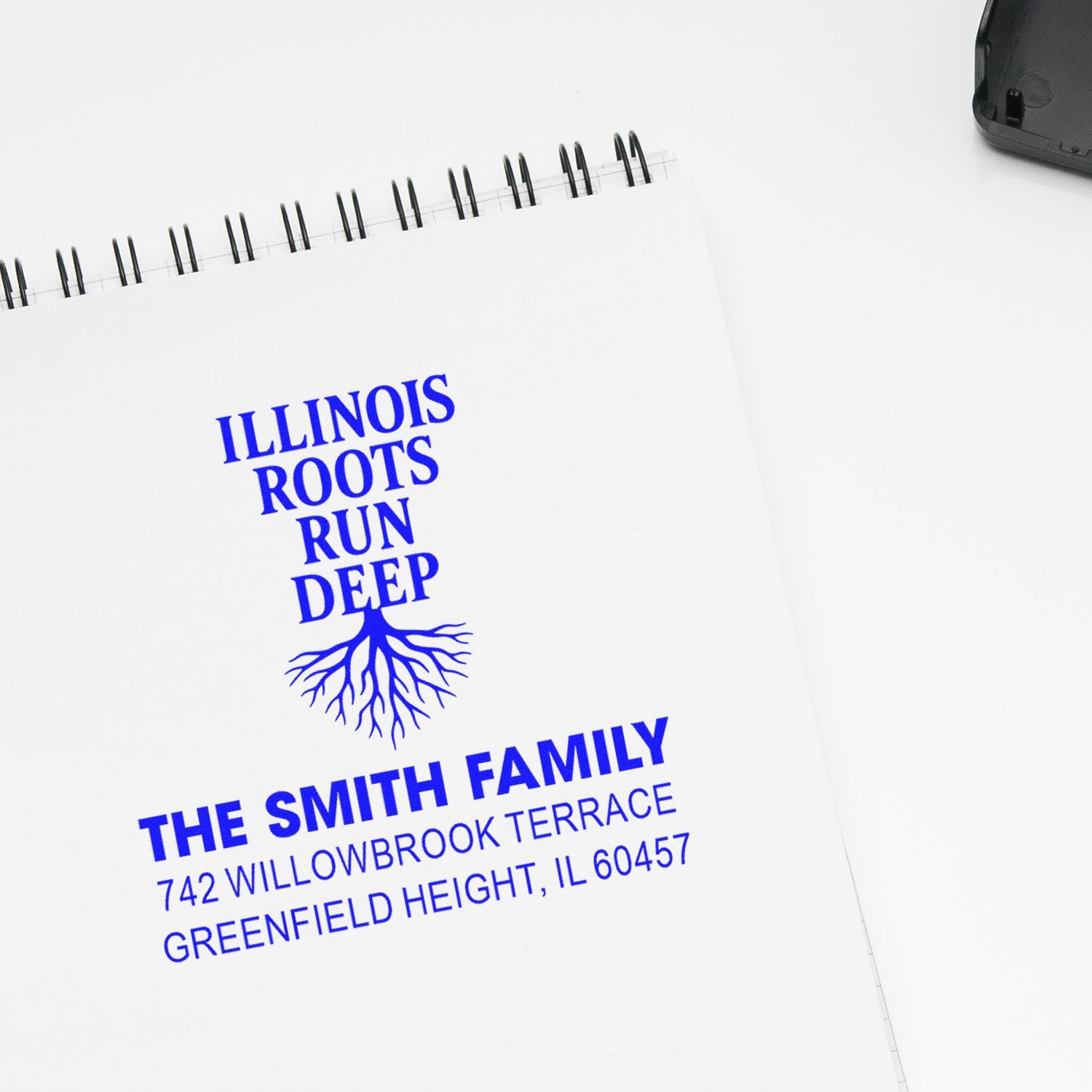 Personalized rubber address stamp impression reading Illinois Roots Run Deep with The Smith Family return address.