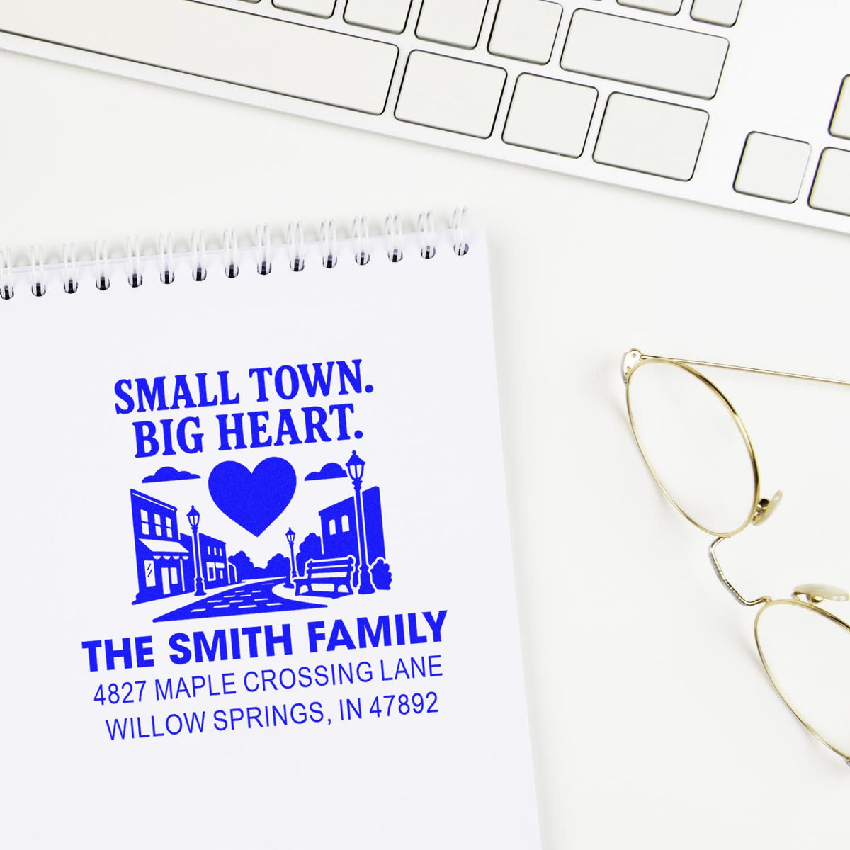 Custom rubber address stamp impression for The Smith Family with Small Town, Big Heart town graphic and return address.