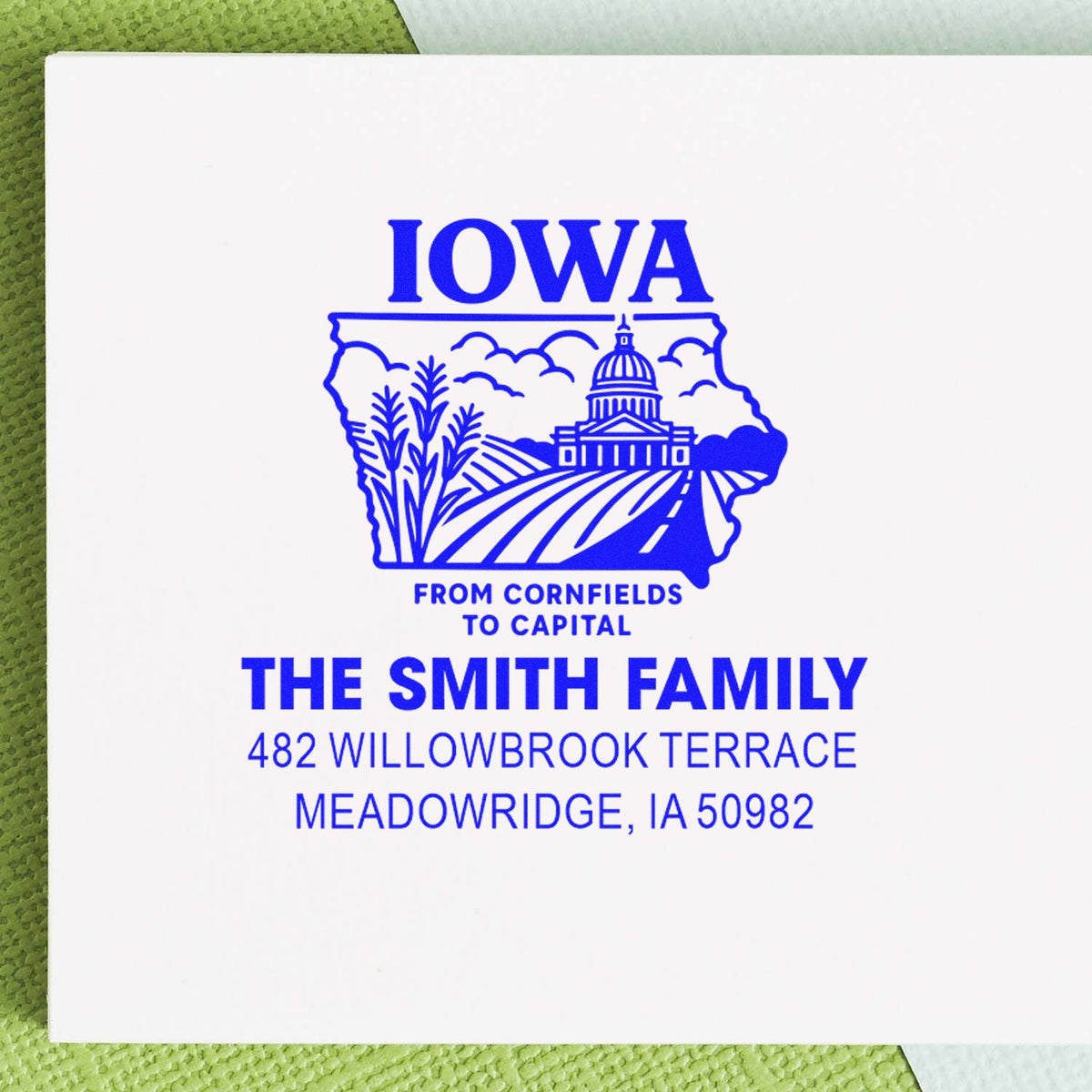 Custom return address rubber stamp with Iowa state design for The Smith Family, Meadowridge, IA 50982