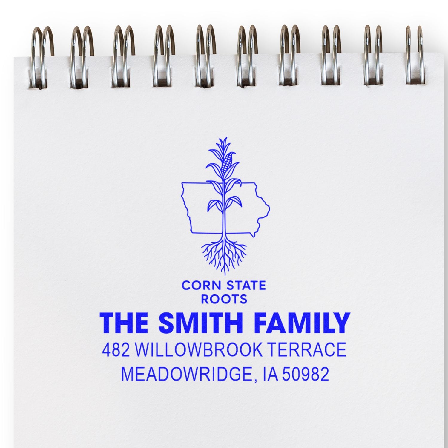 Custom return address rubber stamp for The Smith Family, featuring Iowa corn roots logo and Meadowridge, IA address.