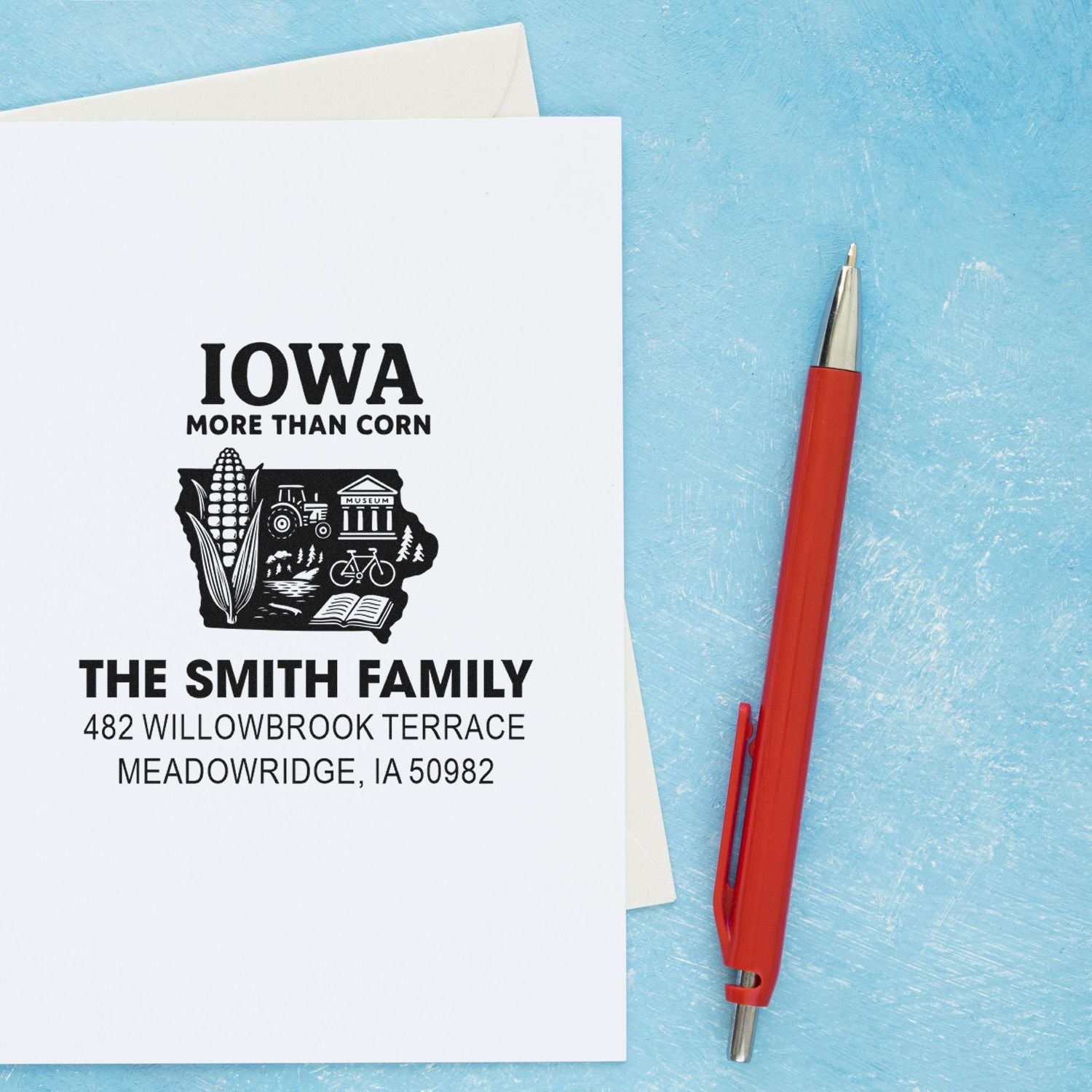 Personalized Iowa return address rubber stamp with family name and state-themed design for mailing envelopes.