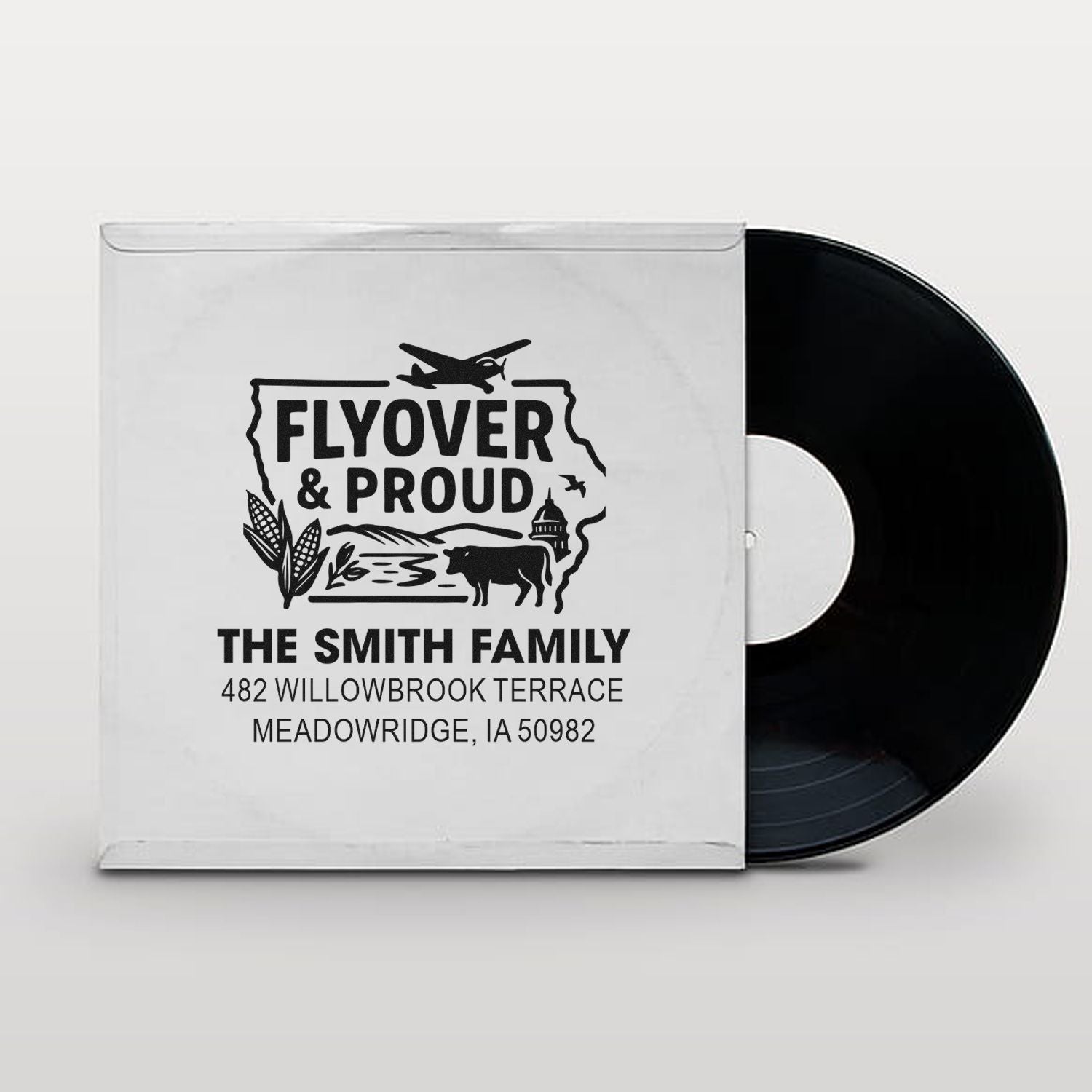 Custom Flyover & Proud rubber stamp with The Smith Family name and address for personalized mail and packaging.