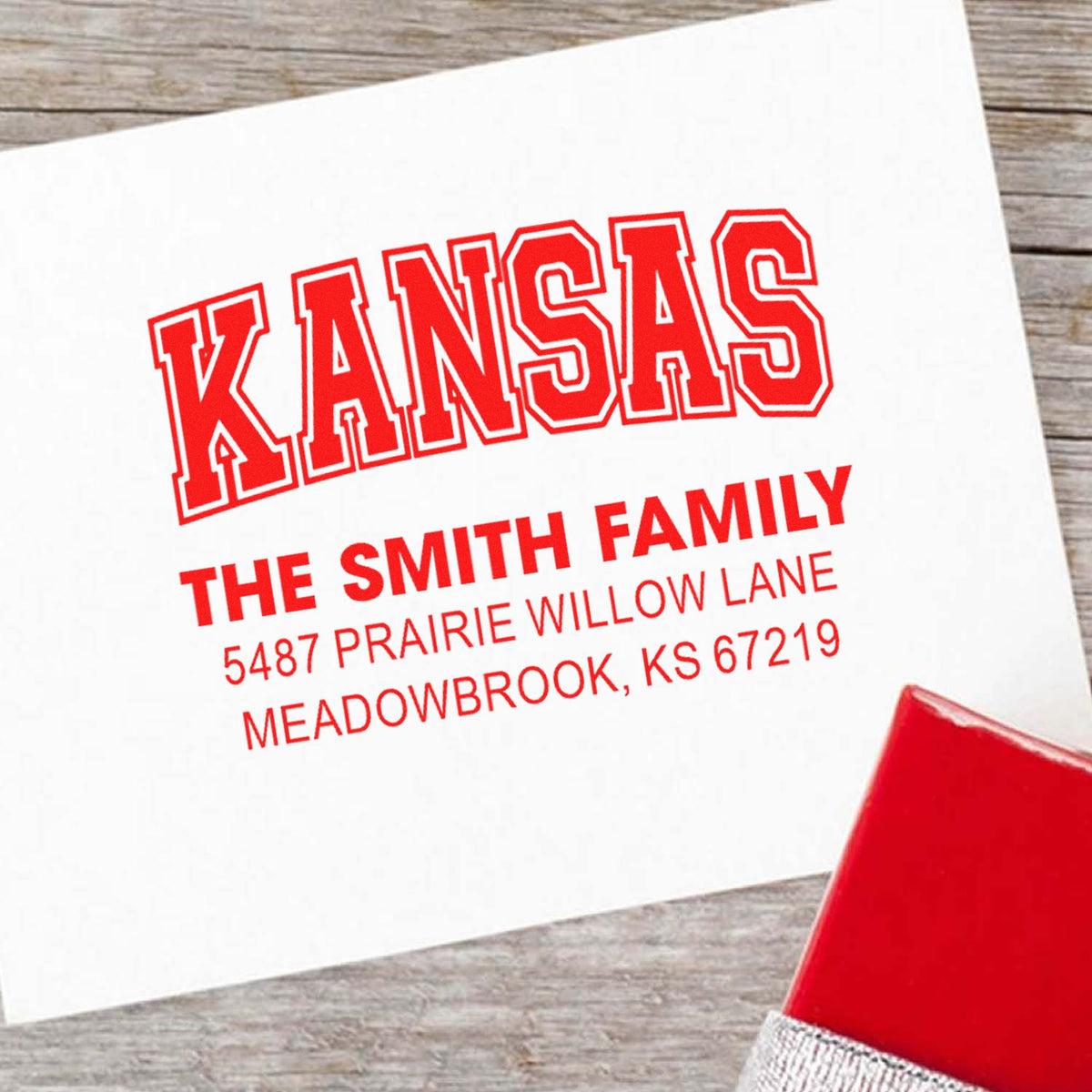 Custom Kansas return address rubber stamp in red ink for The Smith Family and personalized mailings.