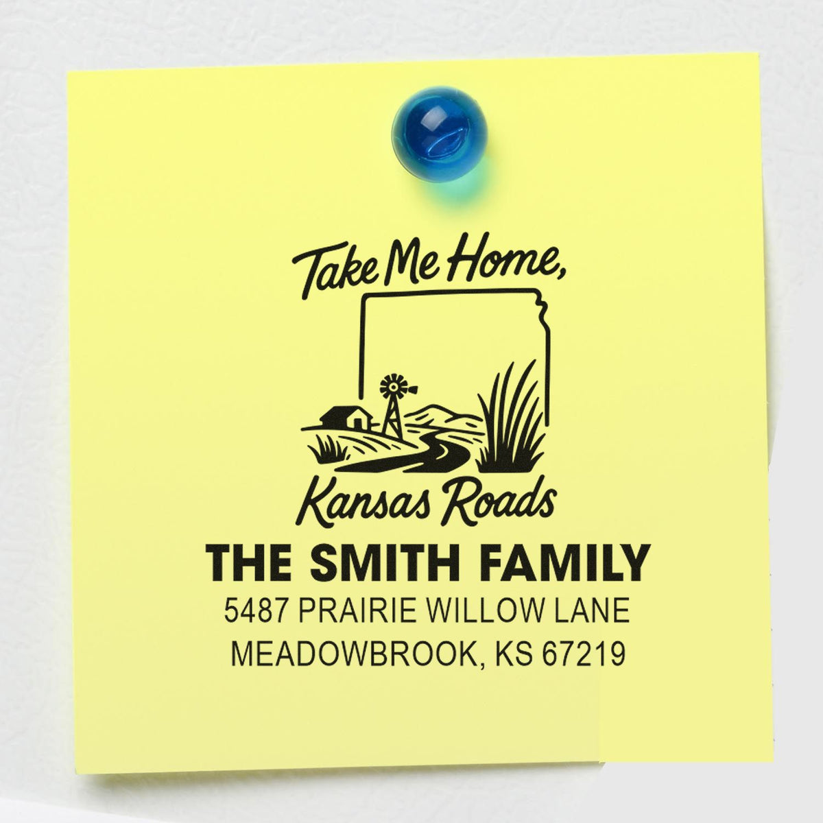 Custom rubber return address stamp with Kansas Roads design and The Smith Family address on a sticky note.