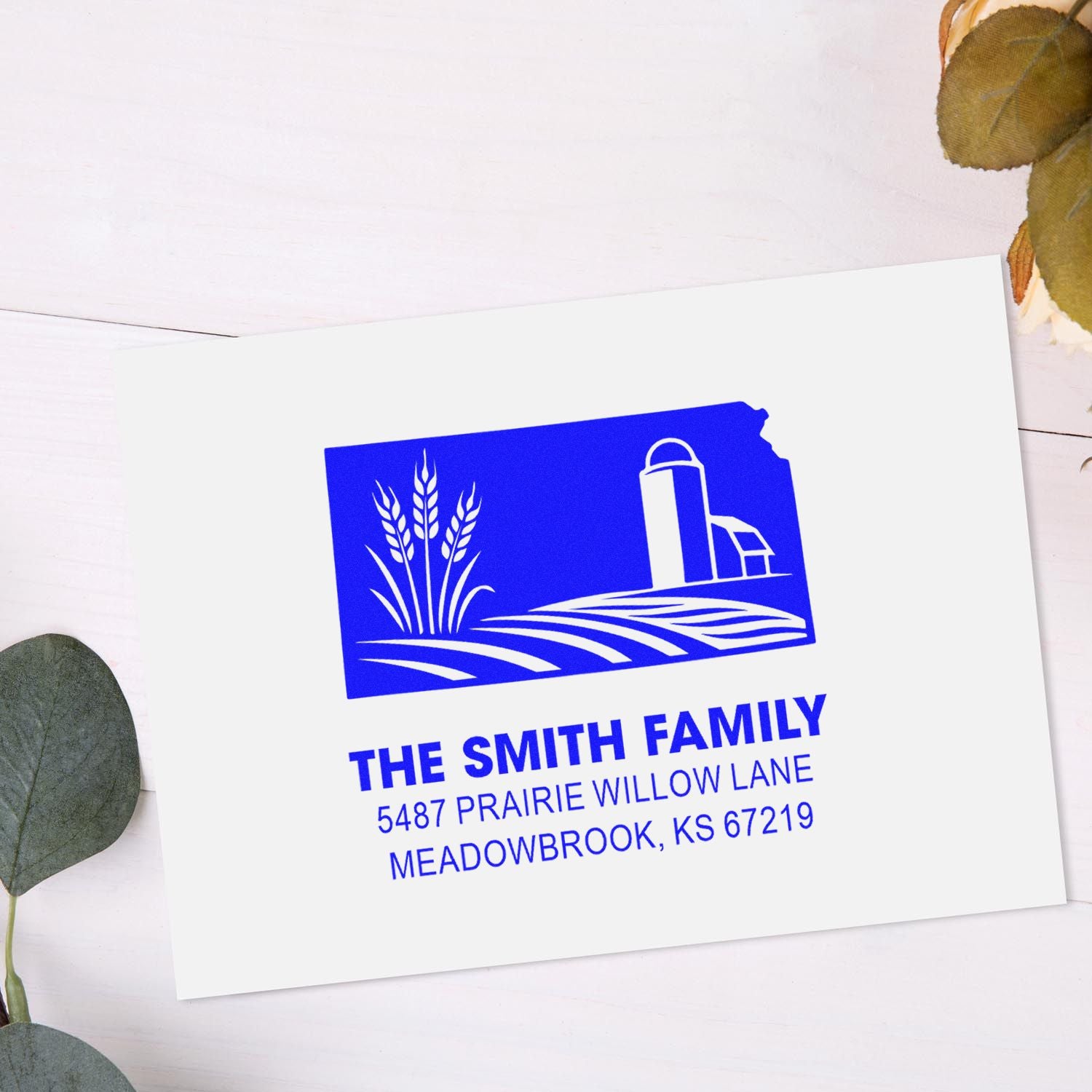 Custom address rubber stamp for The Smith Family, with farm silo and wheat logo and Meadowbrook, KS address.
