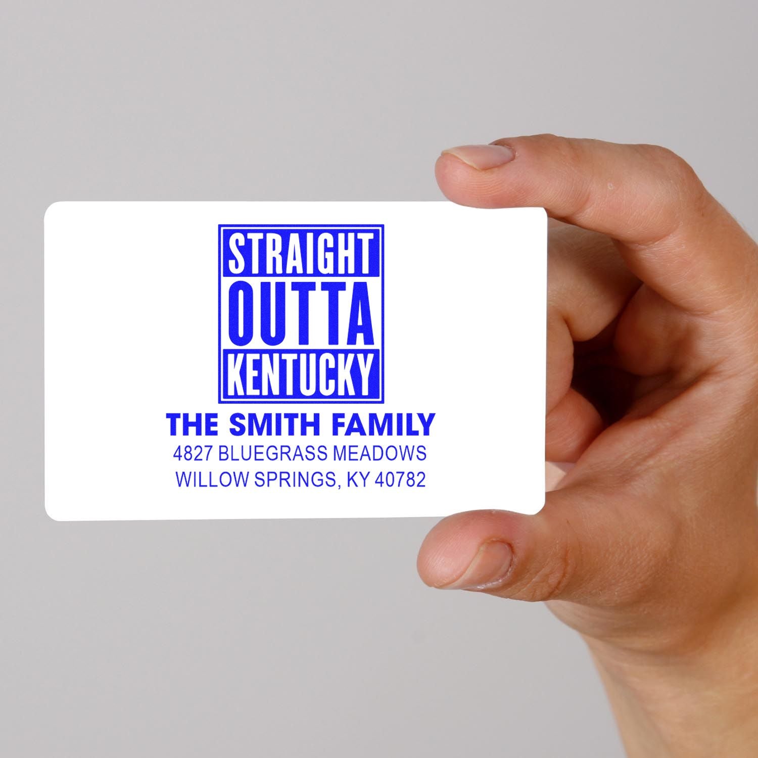 Custom rubber return address stamp proof with Straight Outta Kentucky design for The Smith Family in blue ink style.