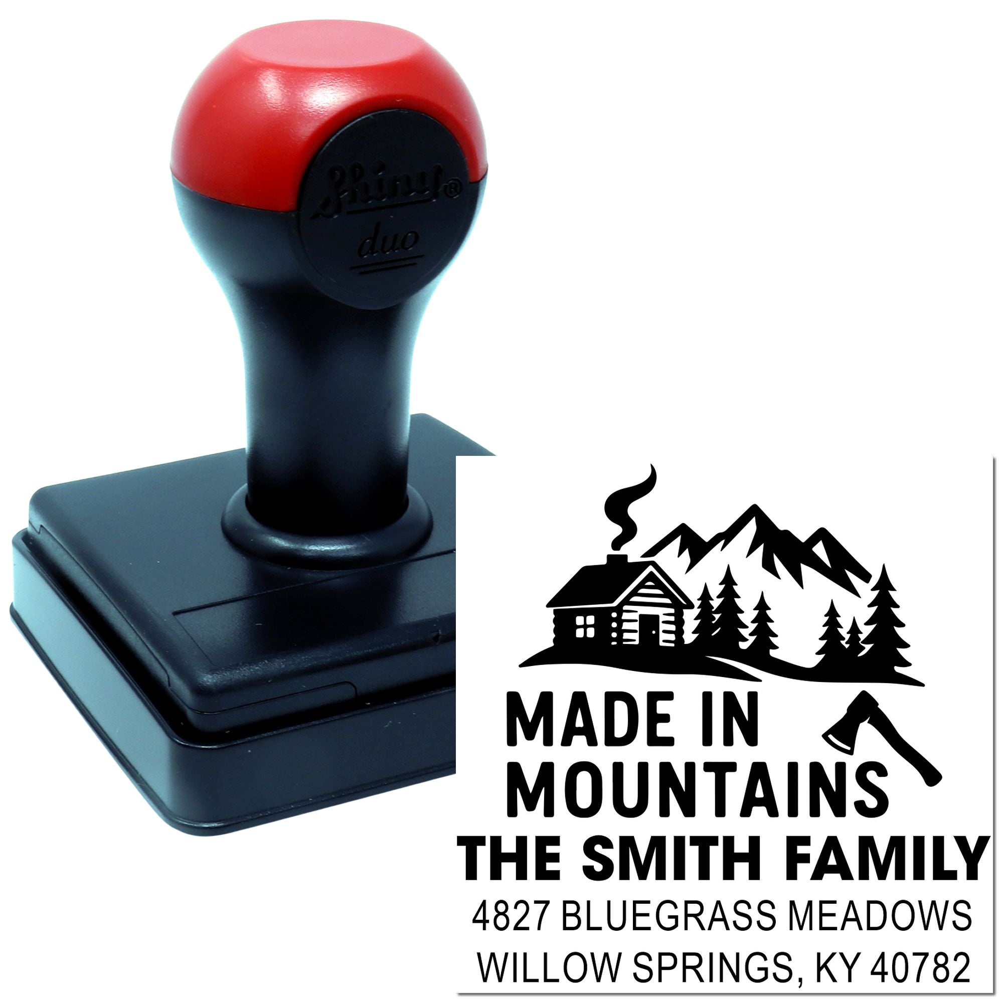 Custom self-inking rubber stamp with Made in Mountains family address design, cabin, trees, and axe graphic.