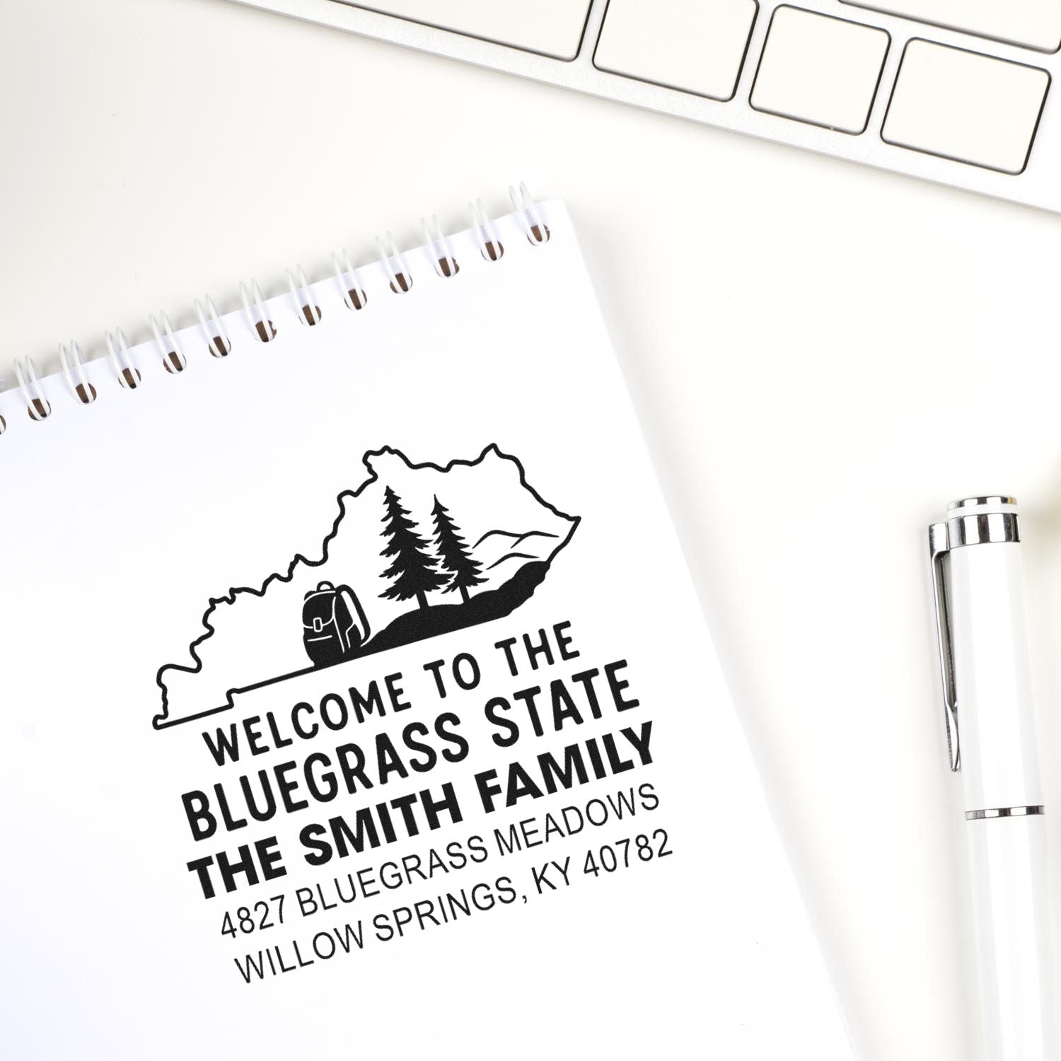 Personalized Kentucky return address rubber stamp with state outline, family name, and address for mailing and branding.