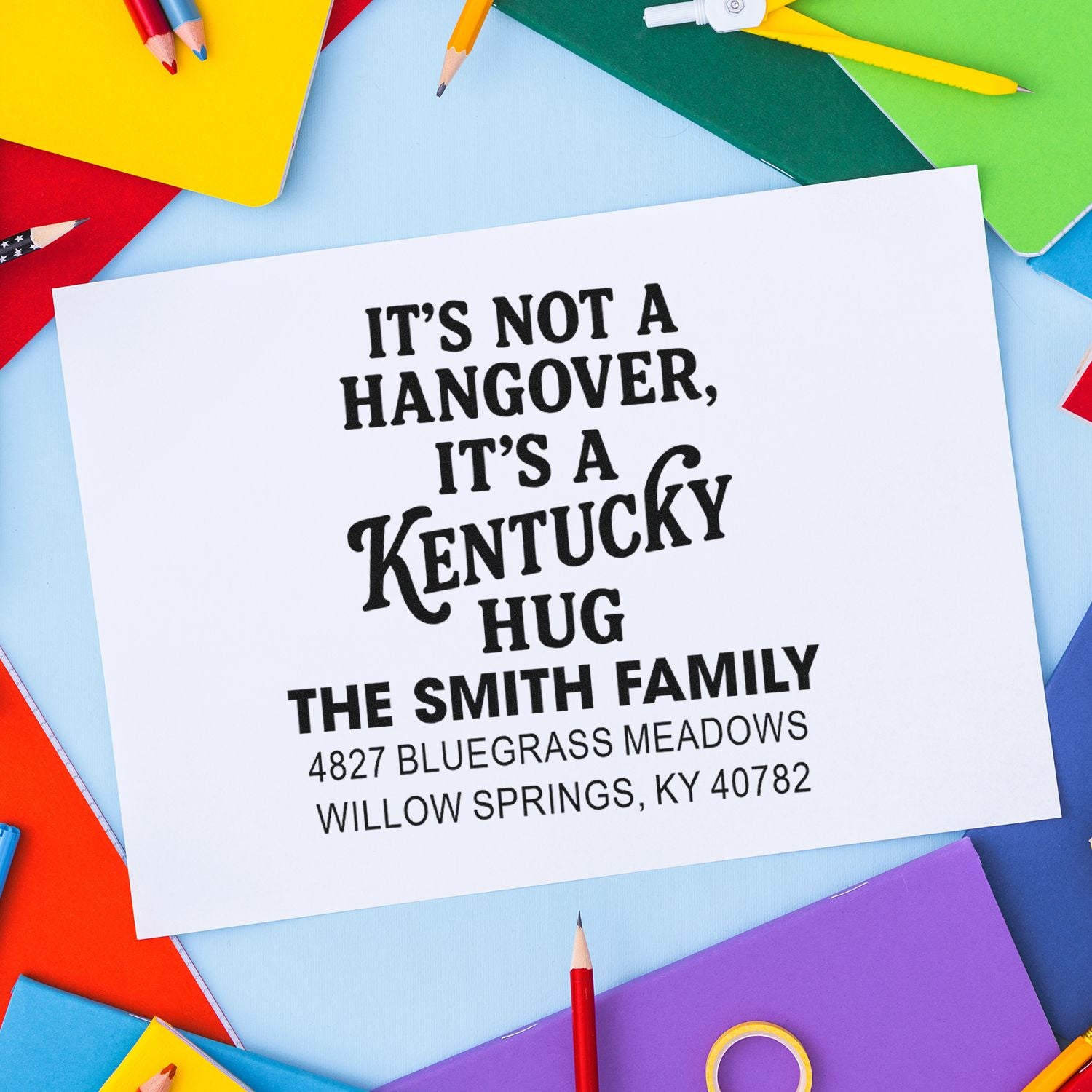 Custom rubber address stamp imprint with Kentucky Hug message and Smith family address for personalized mailings.