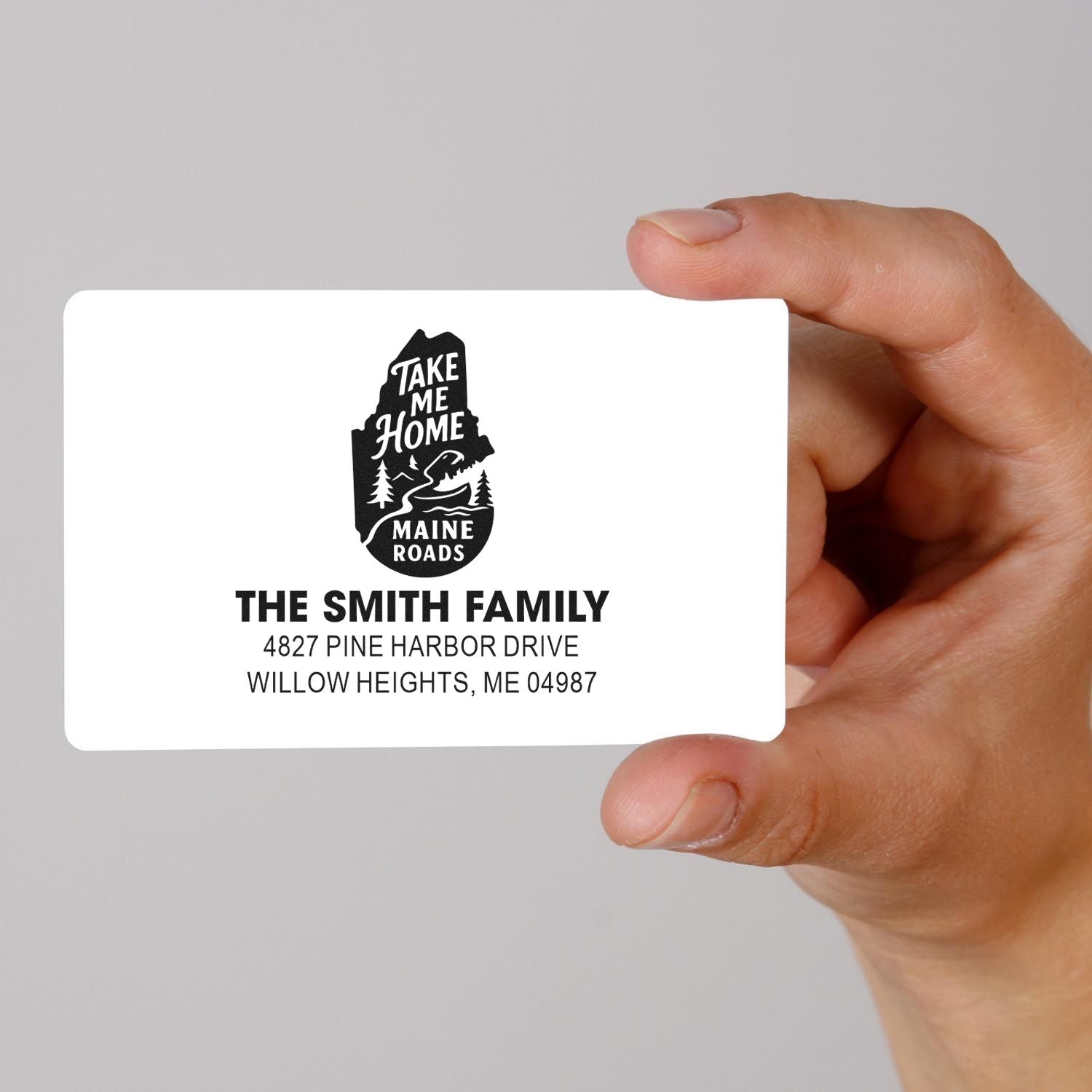 Personalized return address rubber stamp design with Maine Roads graphic, family name, and address for custom mailings.
