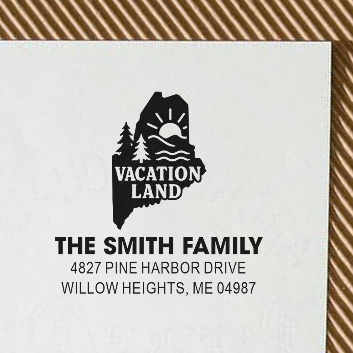 Custom return address rubber stamp with Vacation Land Maine design for The Smith Family home address.