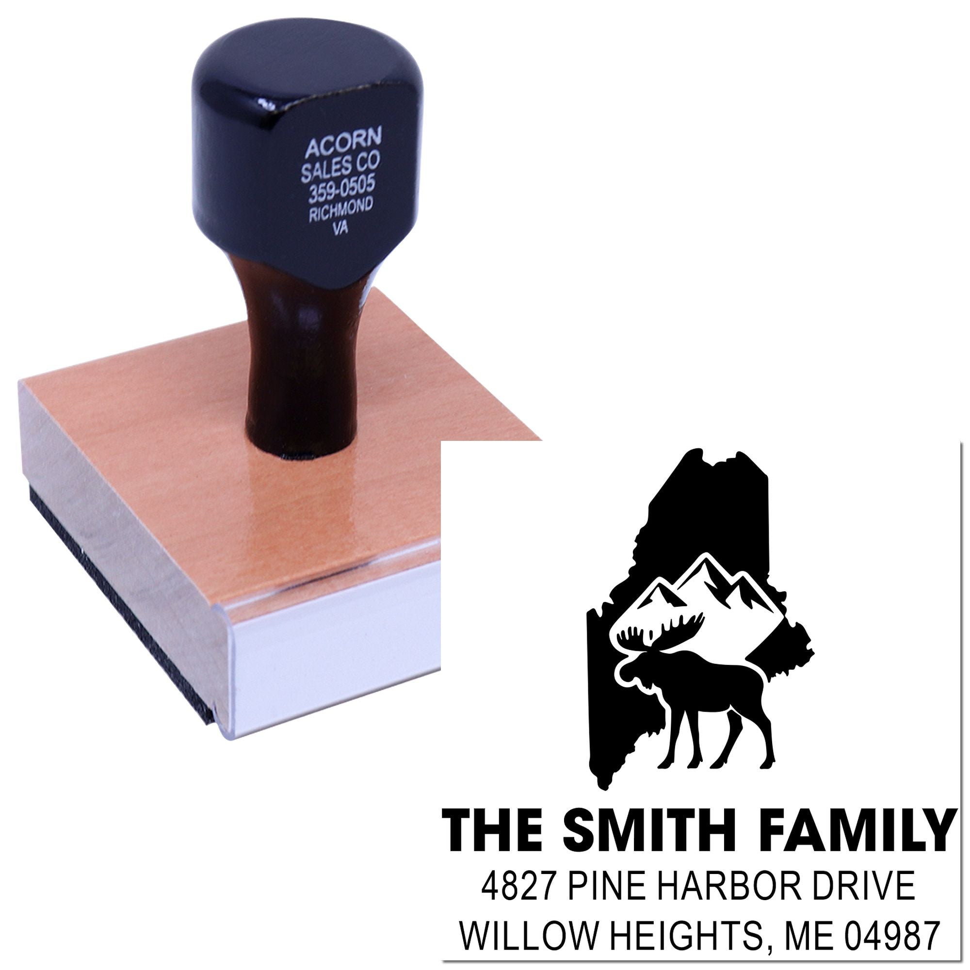 Personalized Maine address rubber stamp with moose and mountain design, shown on a wood block stamp for family mailings.