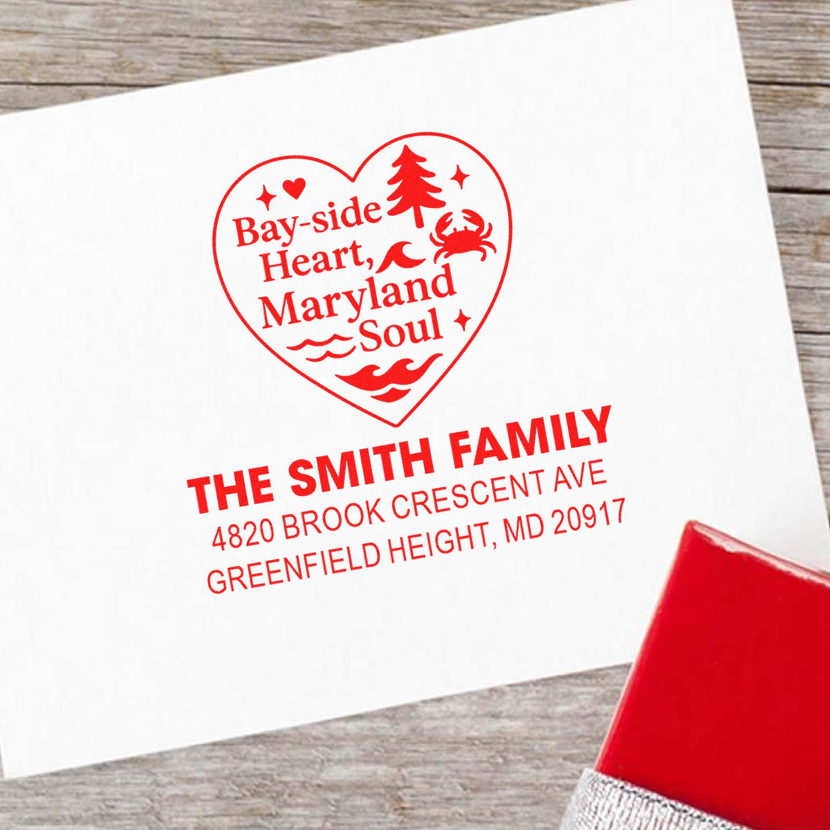 Personalized custom rubber stamp imprint on envelope featuring heart-shaped Bay-side Heart, Maryland Soul design with family name and address.