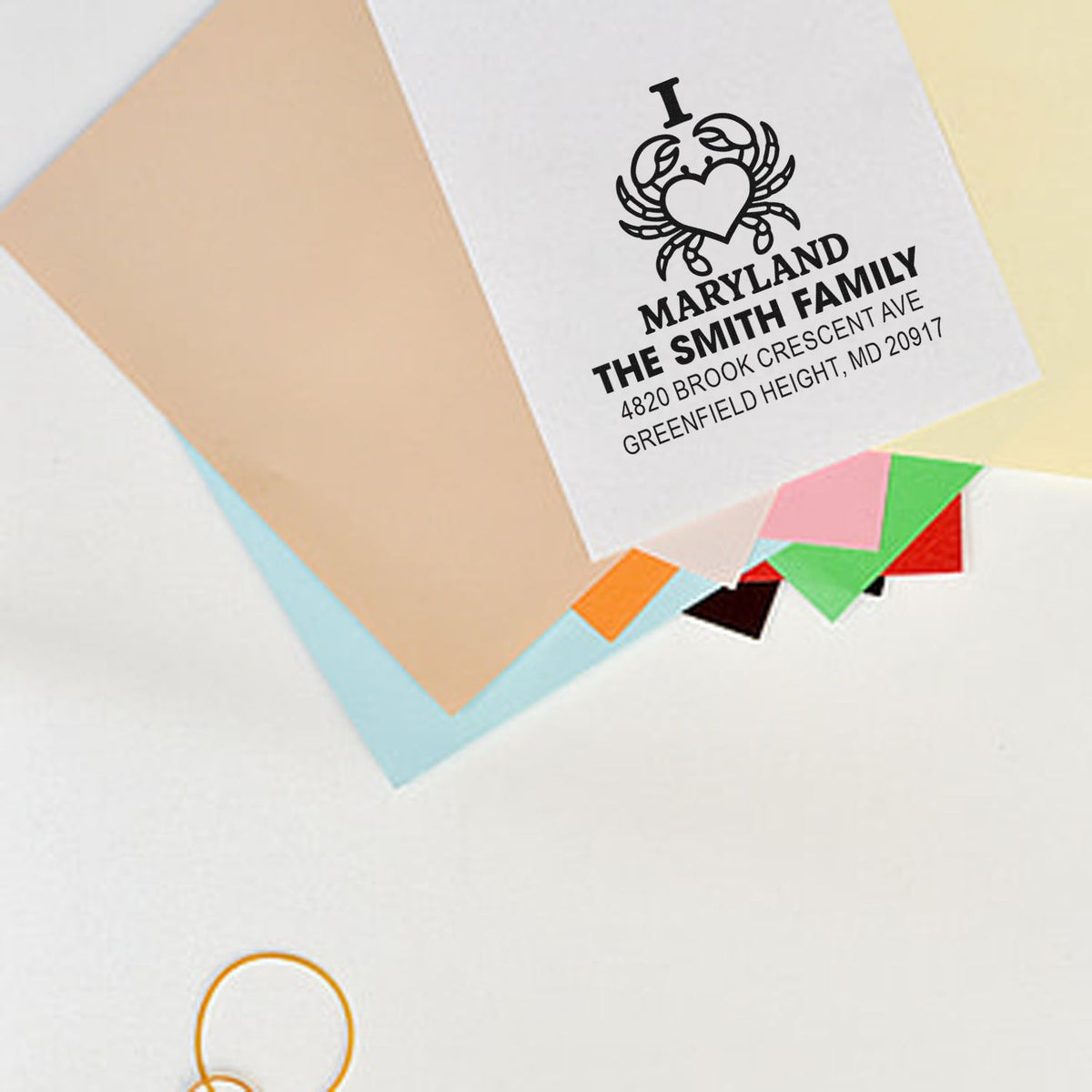 Personalized rubber return address stamp with family name and address for envelopes and wedding stationery.