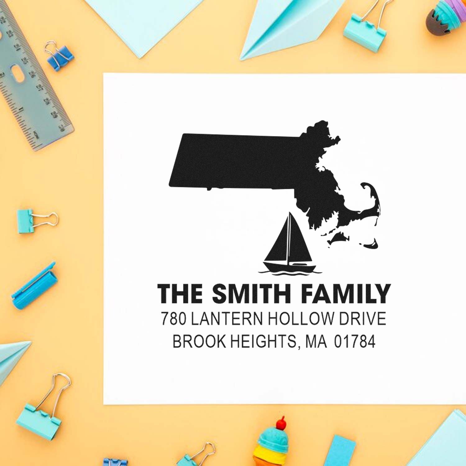Custom address rubber stamp with Massachusetts silhouette, sailboat design, and return mailing address for The Smith Family.