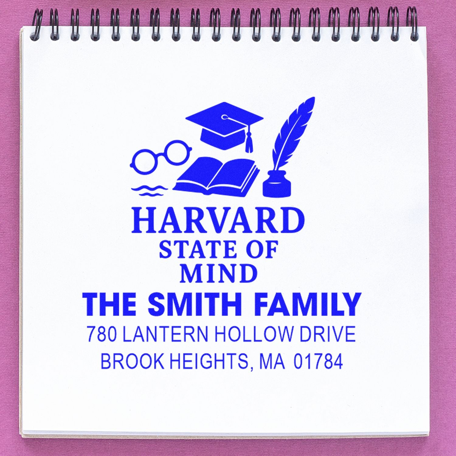 Custom rubber stamp impression featuring Harvard State of Mind, The Smith Family, and address on a notebook page.