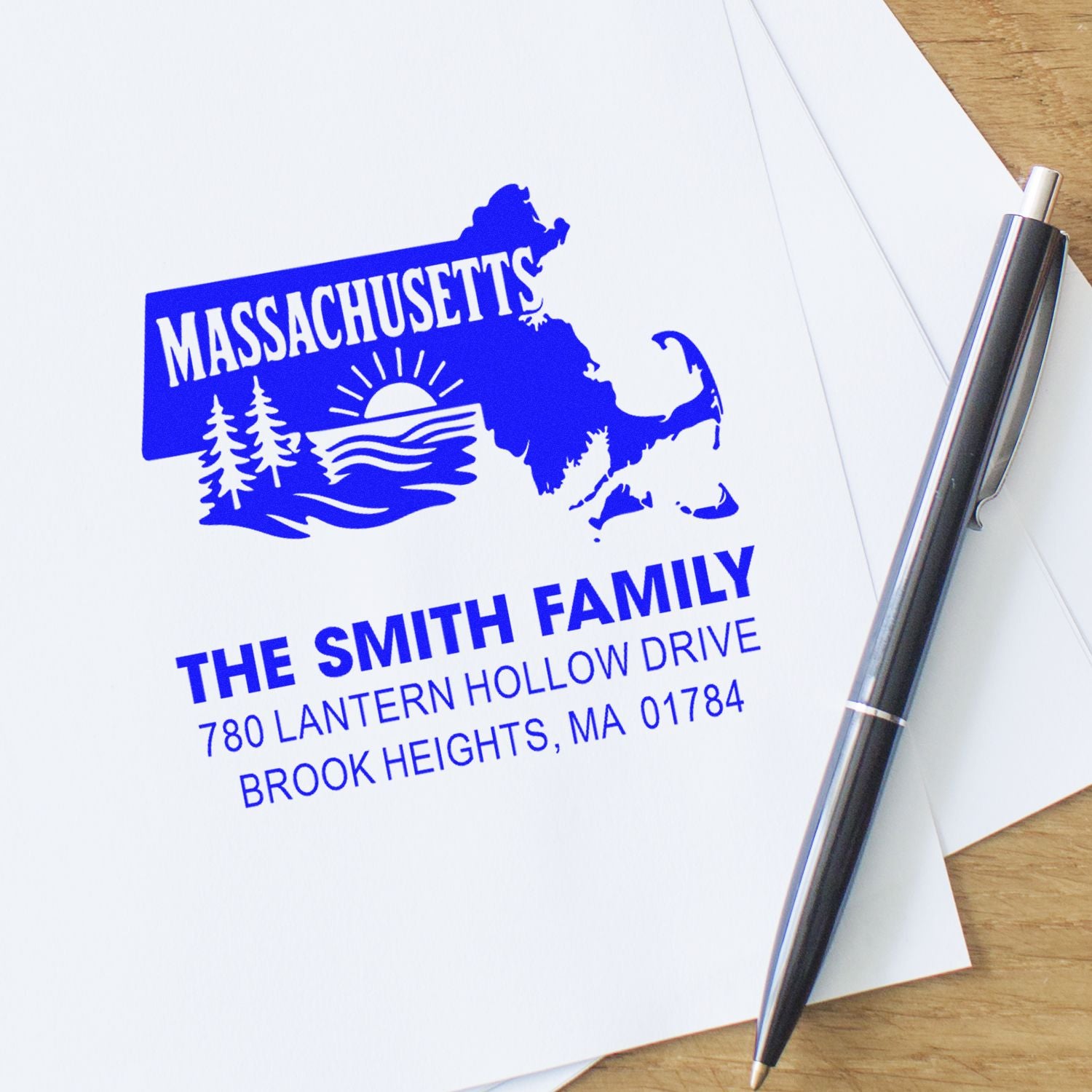 Custom Massachusetts rubber address stamp with family name and Brook Heights, MA return address on paper