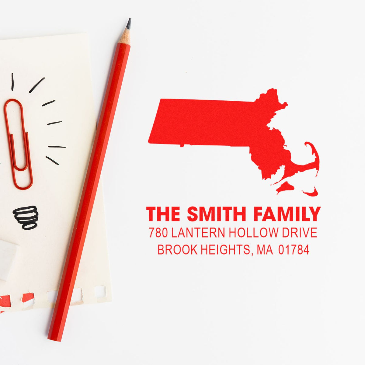 Custom return address rubber stamp with Massachusetts silhouette, personalized family name and address for mailing.