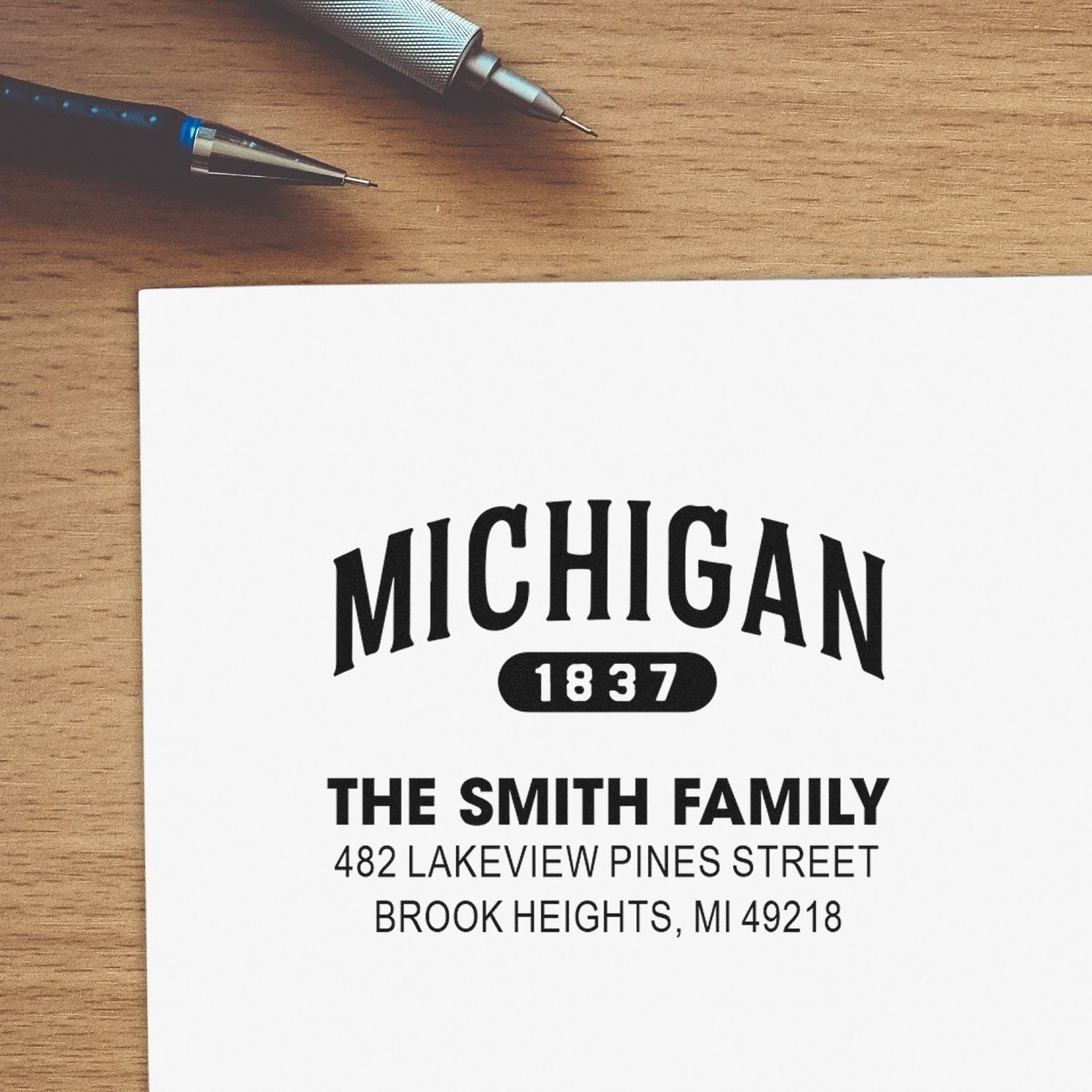 Personalized rubber address stamp for the Smith family with Michigan 1837 design and custom return mailing address.