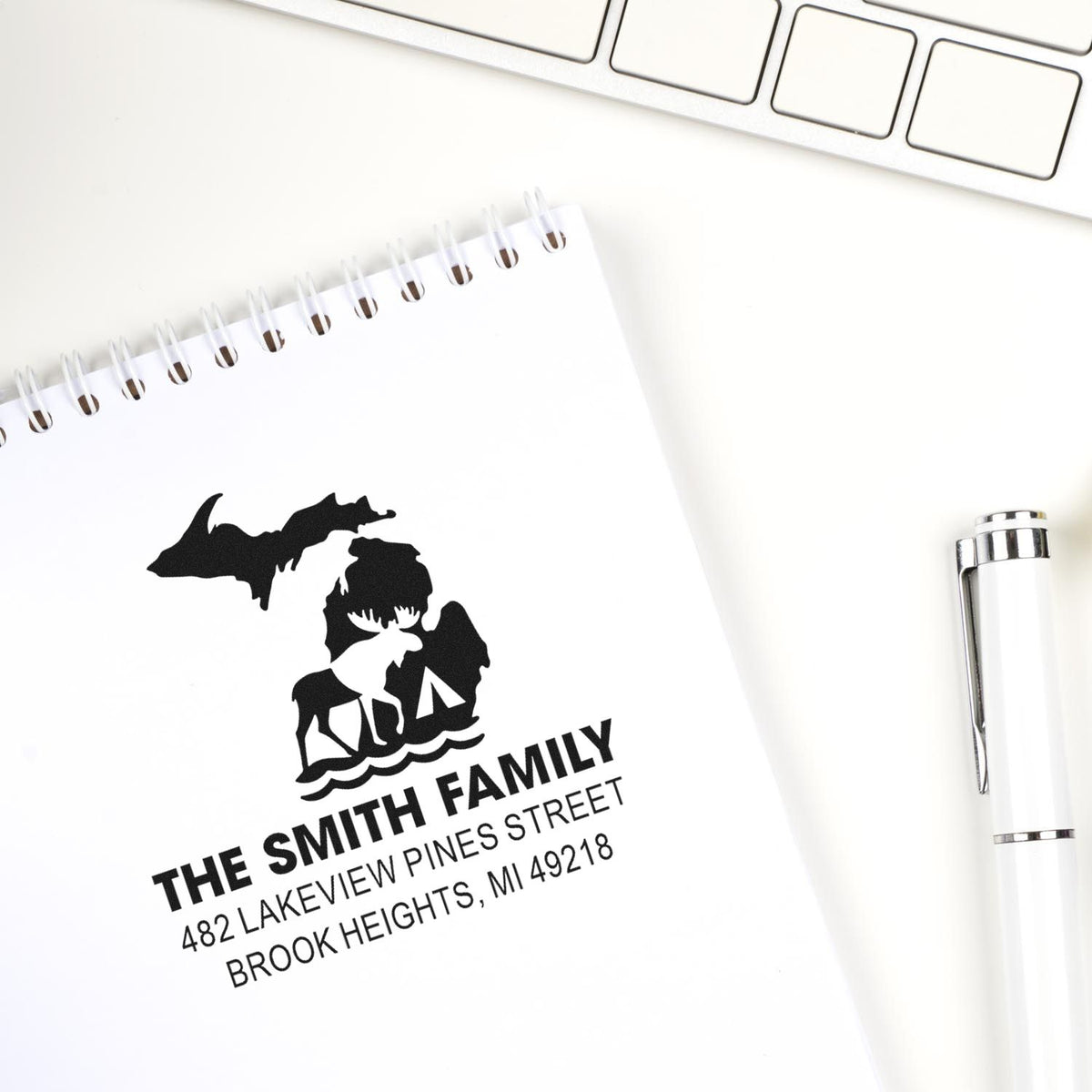 Custom family address rubber stamp with wildlife design for personalized stationery, cards, and mailing labels.