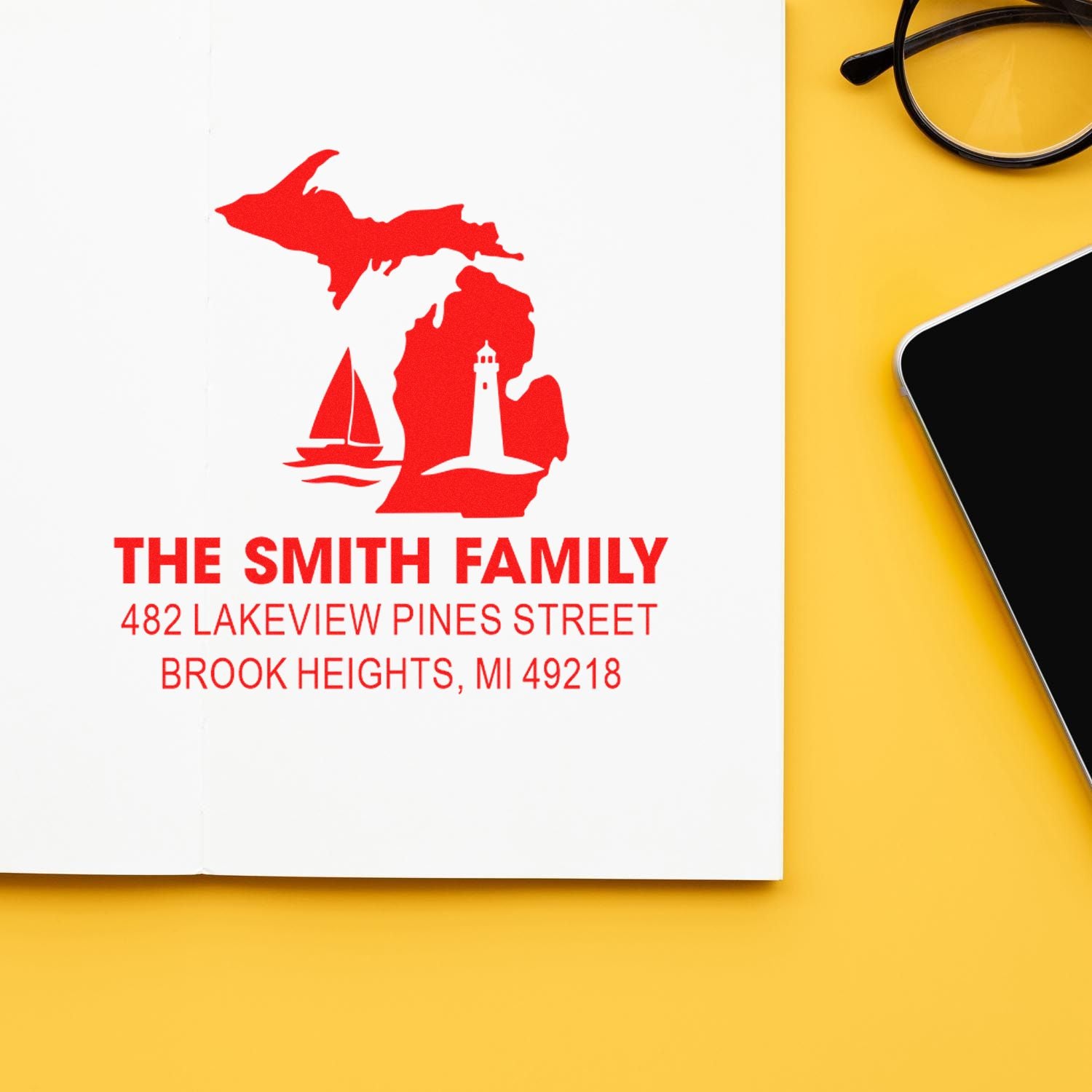 Custom family return address rubber stamp with Michigan sailboat and lighthouse design for personalized envelopes.