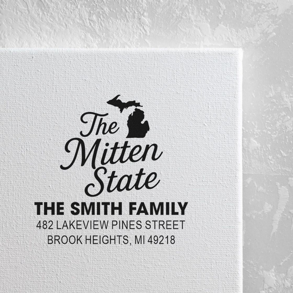 Custom return address rubber stamp for The Smith Family with Michigan The Mitten State design and address.