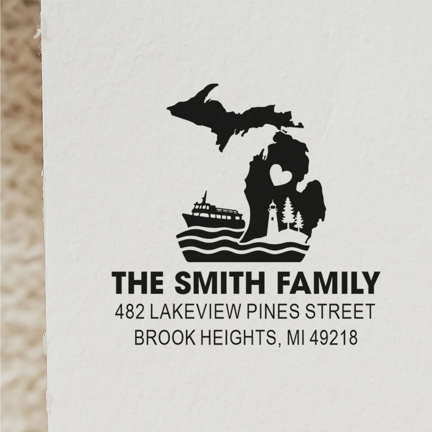 Custom return address rubber stamp for The Smith Family in Brook Heights, MI with Michigan lighthouse, ferry and heart design.