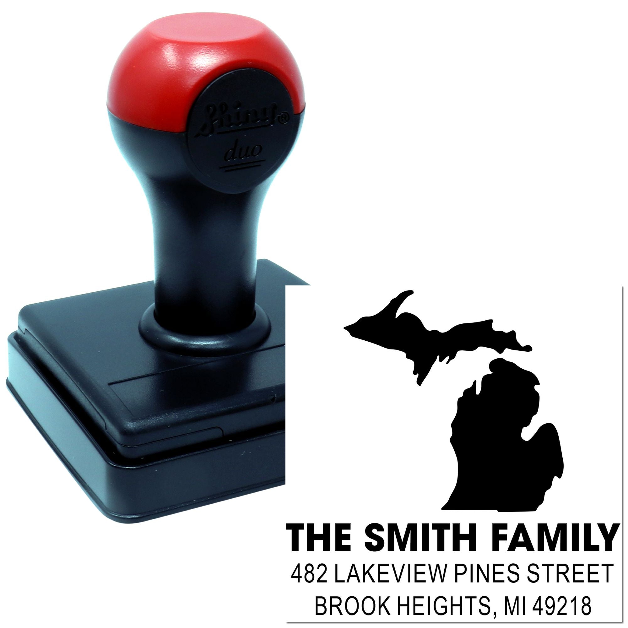 Custom self-inking Michigan return address rubber stamp with family name and address, ideal for personalized mailing.