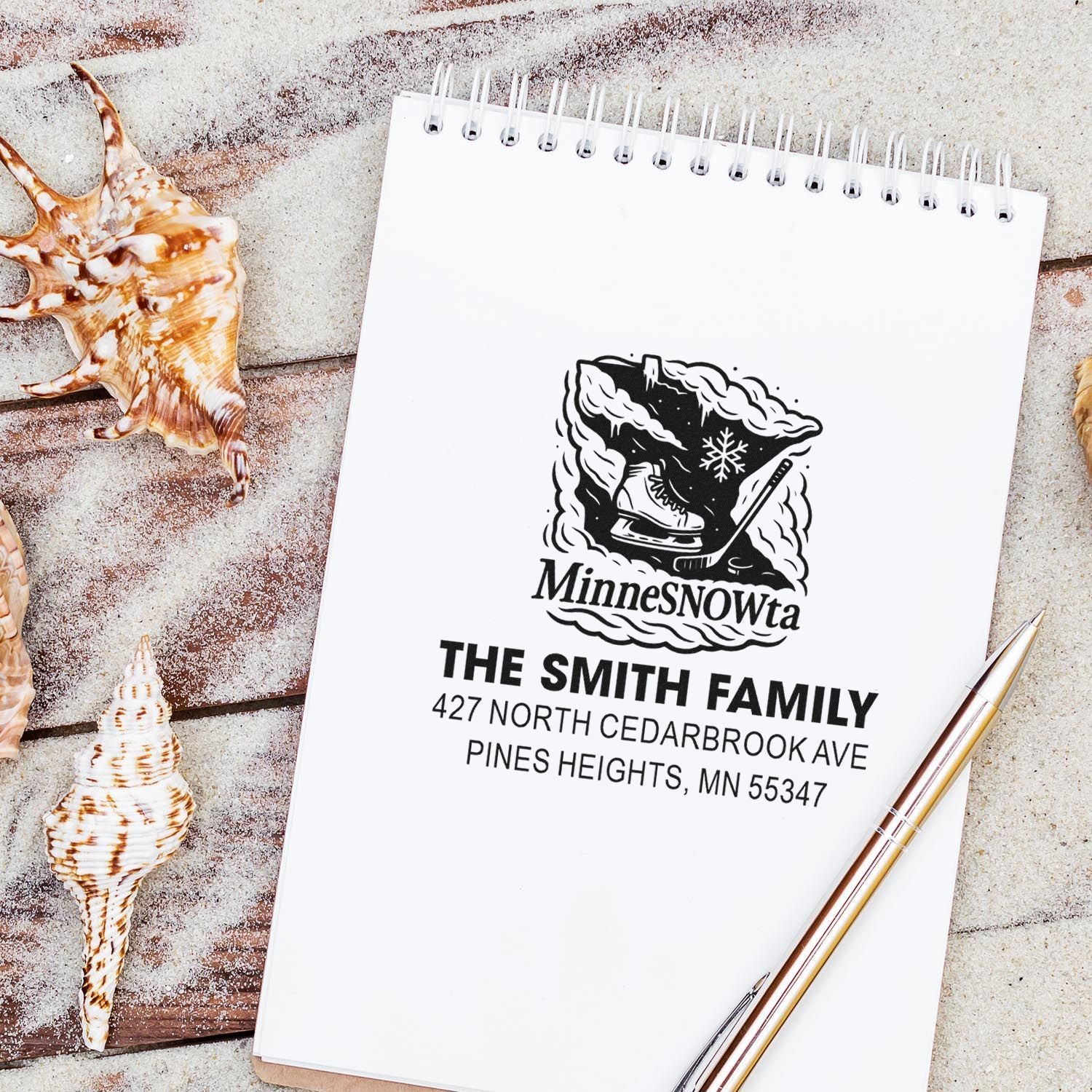 Personalized Minnesota family return address rubber stamp with winter hockey design on notebook