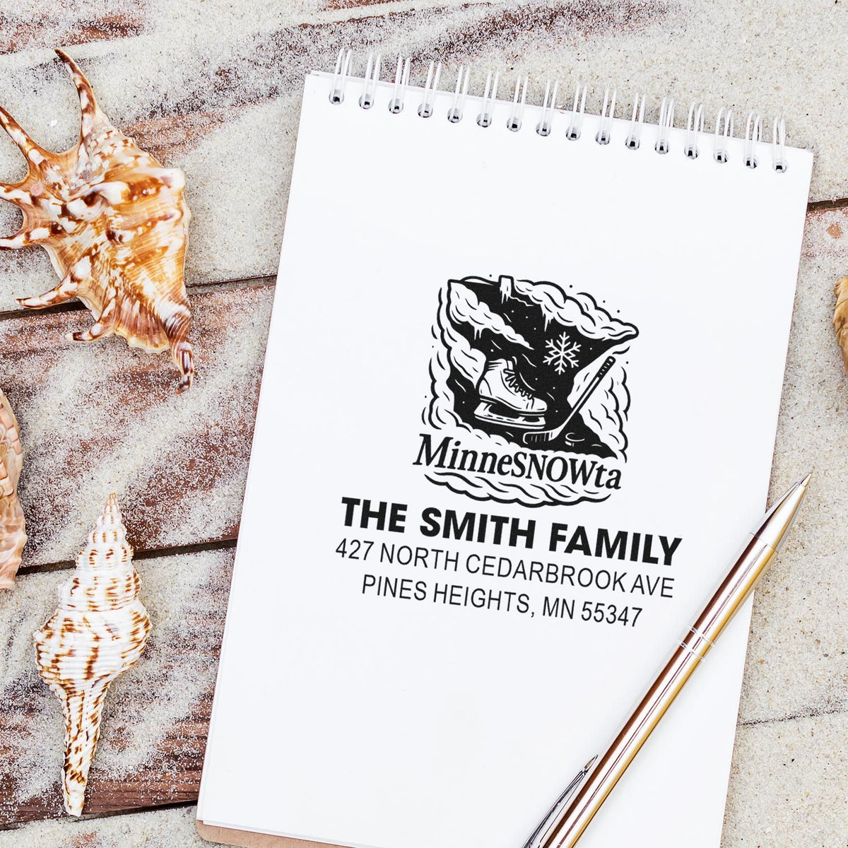 Personalized return address rubber stamp with MinnesNOWta hockey design, featuring a family name and Minnesota address.
