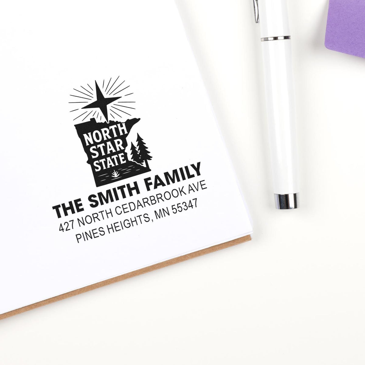 Custom rubber address stamp with North Star State design, Smith family name, and return address.