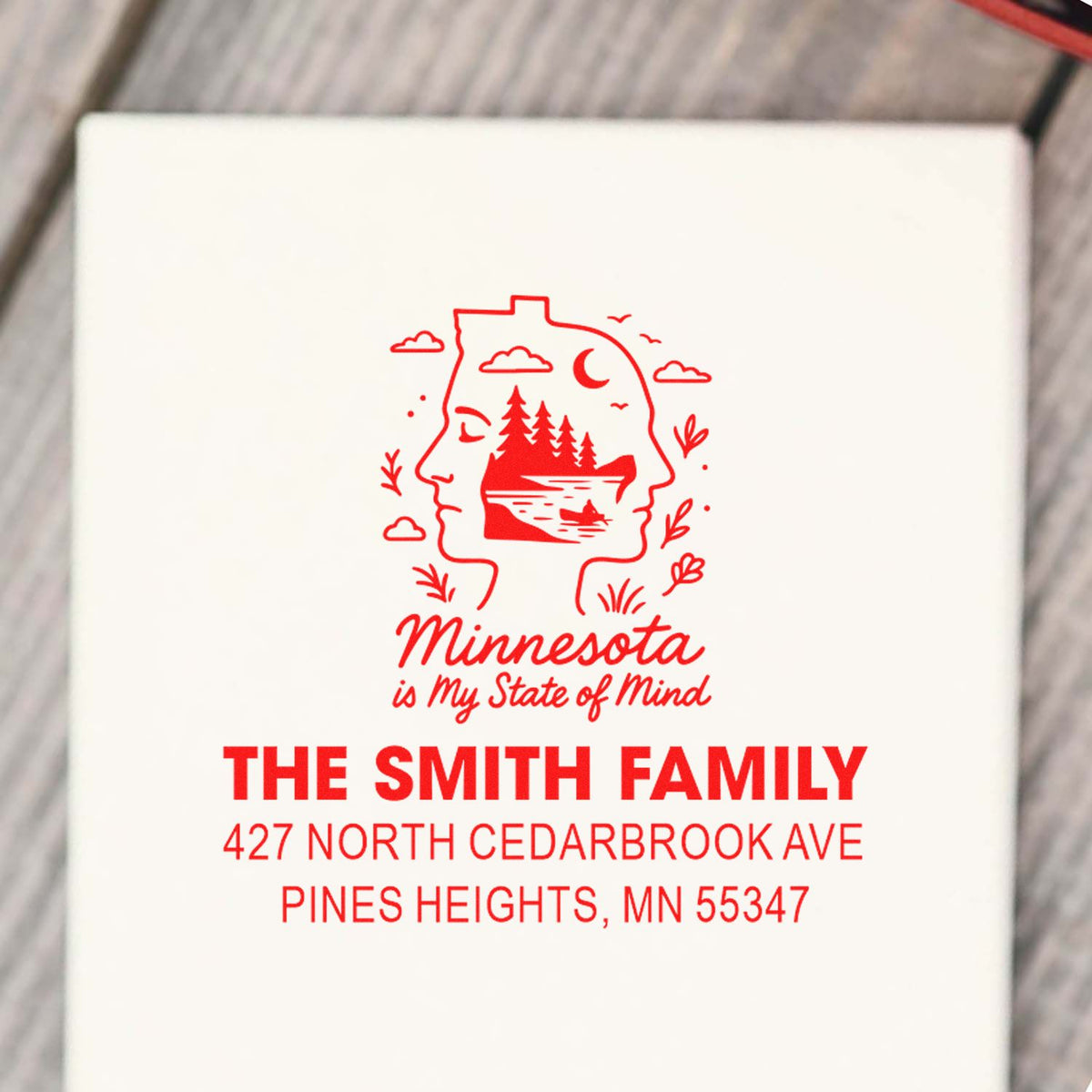 Custom Minnesota address rubber stamp for The Smith Family with state design and Pines Heights, MN return address.