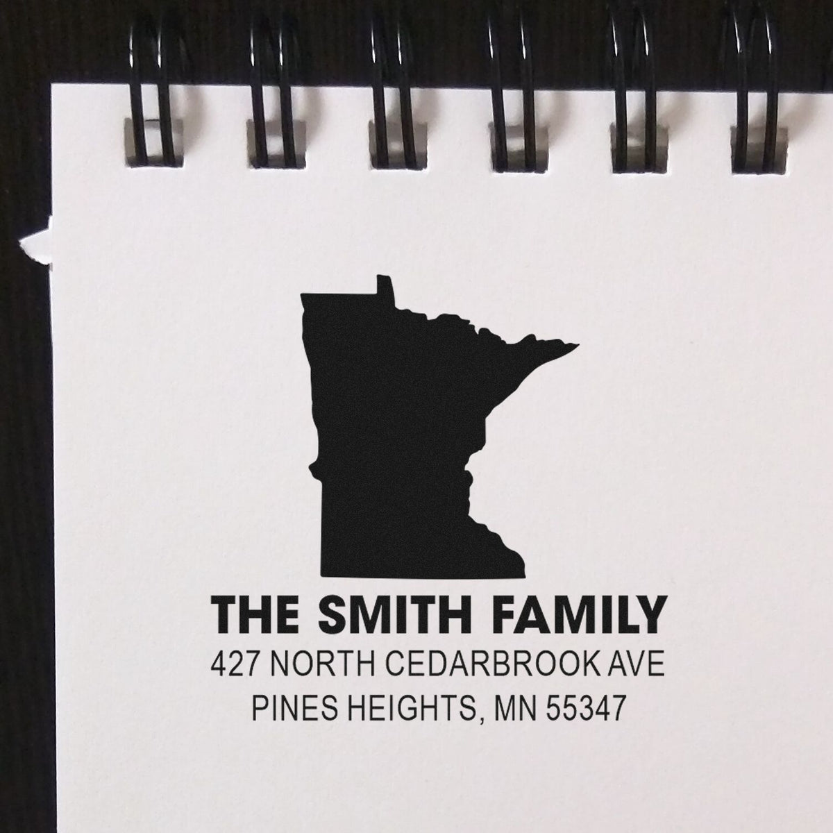 Custom Minnesota return address rubber stamp with state silhouette, family name, and mailing address for envelopes.