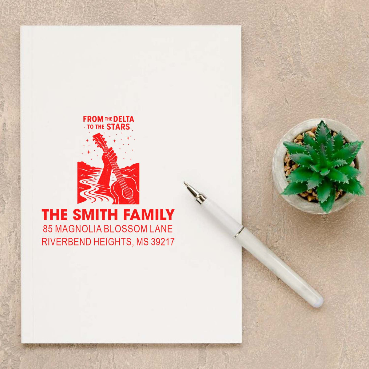 Custom return address rubber stamp with Delta guitar design for The Smith Family, Riverbend Heights, MS 39217