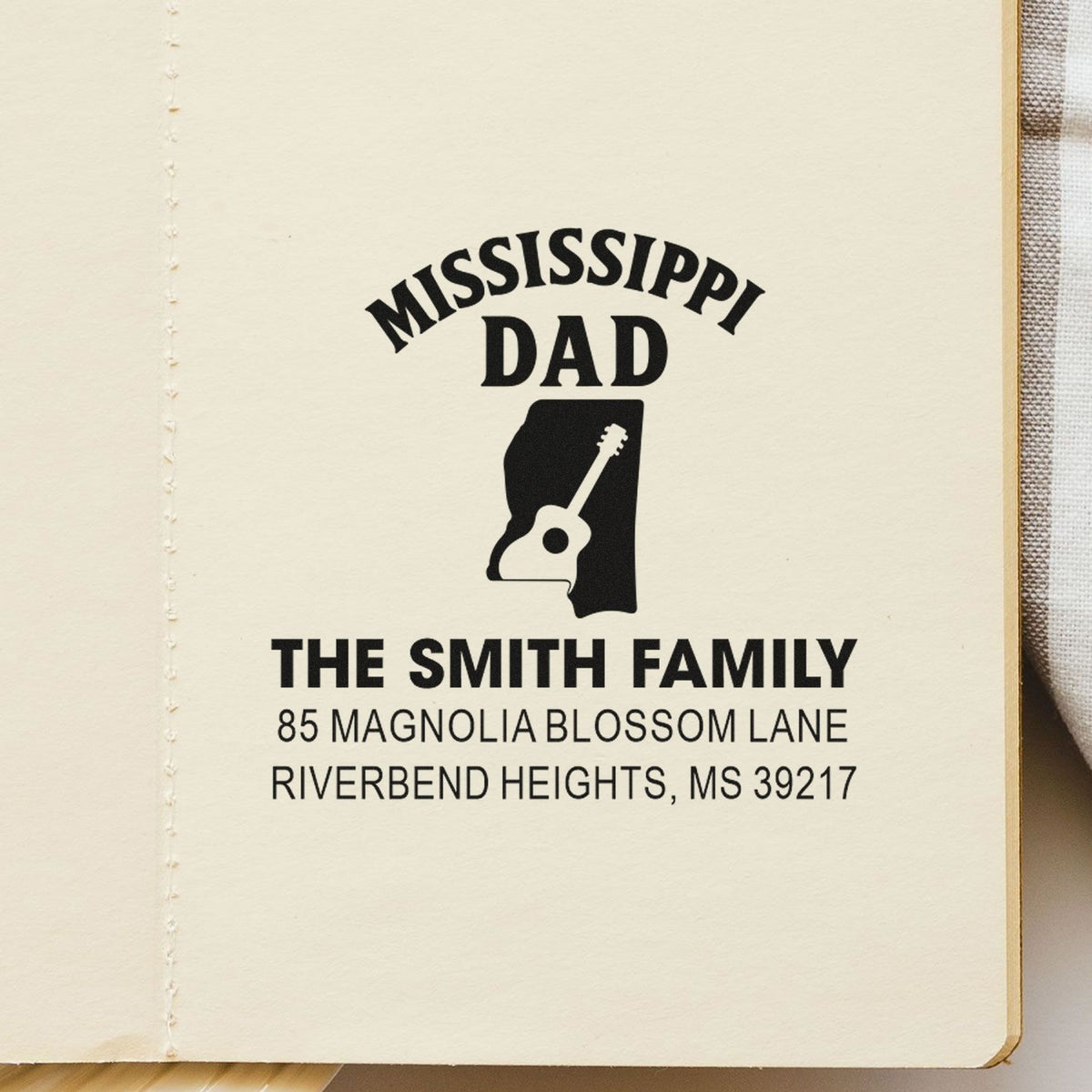 Personalized Mississippi Dad rubber stamp with guitar icon and family return address for custom stationery.