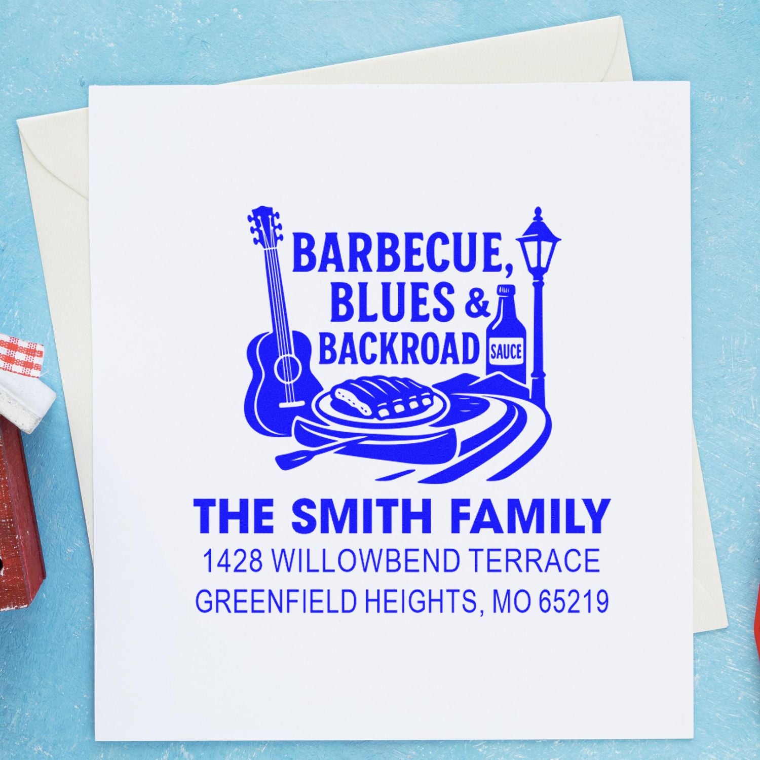 Custom BBQ-themed rubber stamp with family name and address for personalized return addressing on envelopes and stationery.