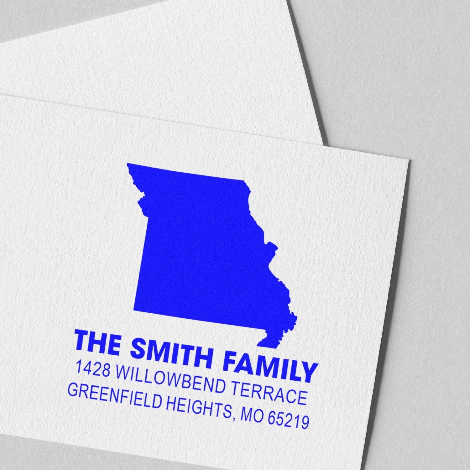 Custom Missouri return address rubber stamp with state silhouette and Smith family address, Greenfield Heights, MO.