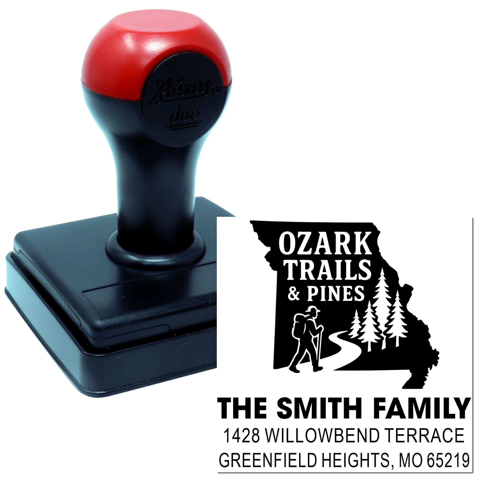 Custom self-inking rubber address stamp for The Smith Family with Ozark Trails & Pines design, Greenfield Heights, MO 65219.