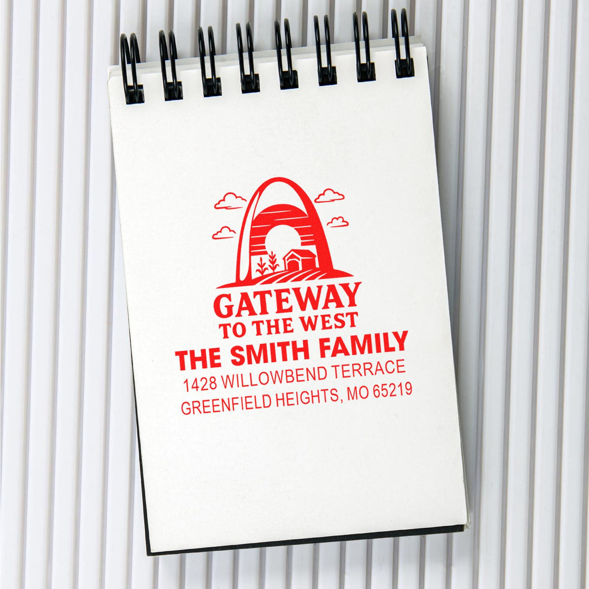 Personalized return address rubber stamp with Gateway to the West design for The Smith Family in red ink.
