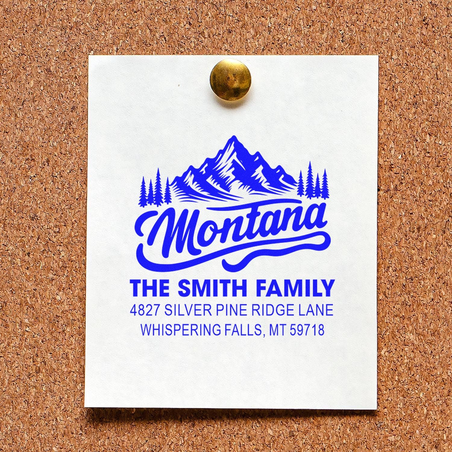 Custom Montana family return address rubber stamp with mountain design and home address printed in blue.
