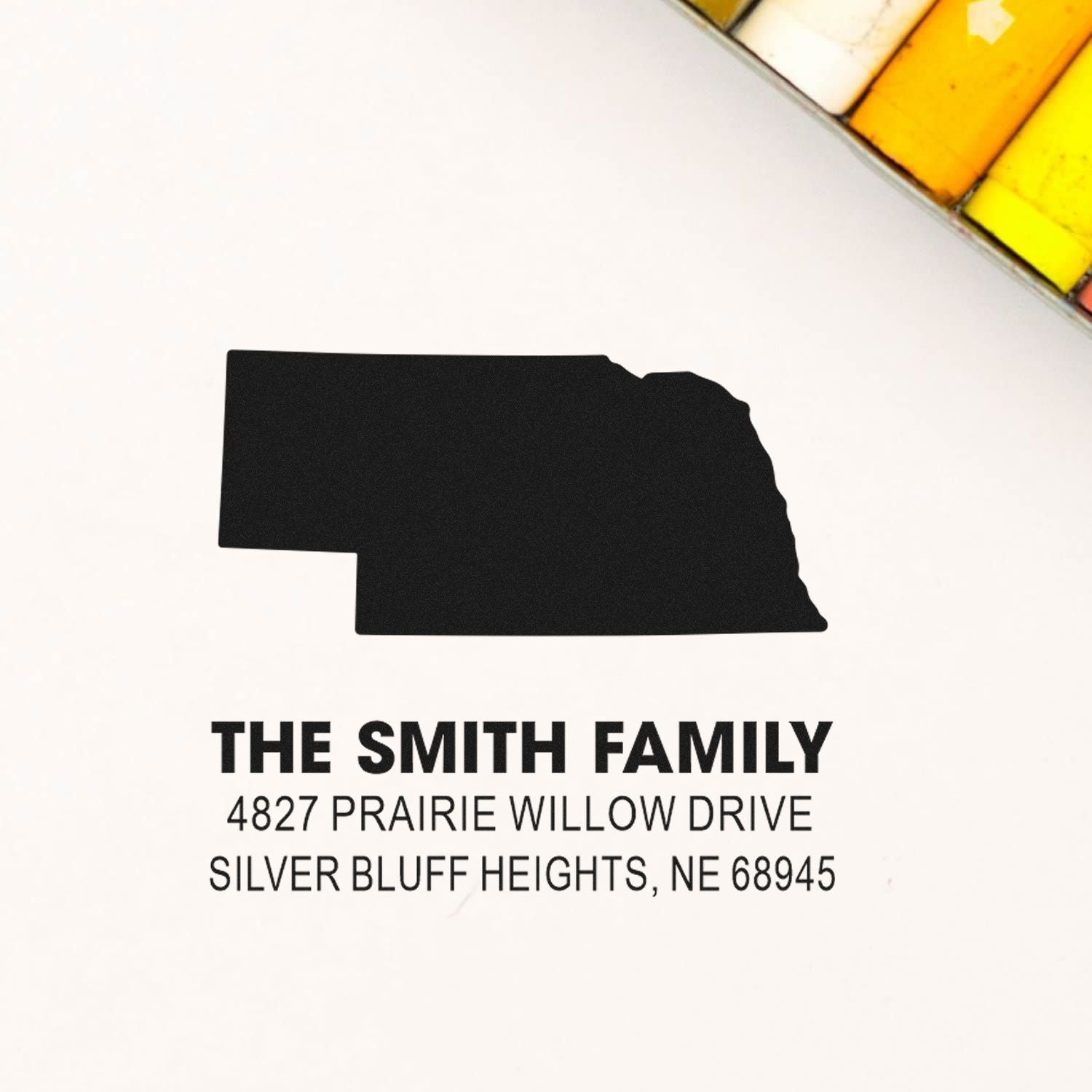 Custom Nebraska return address rubber stamp for The Smith Family with state outline and Silver Bluff Heights address.