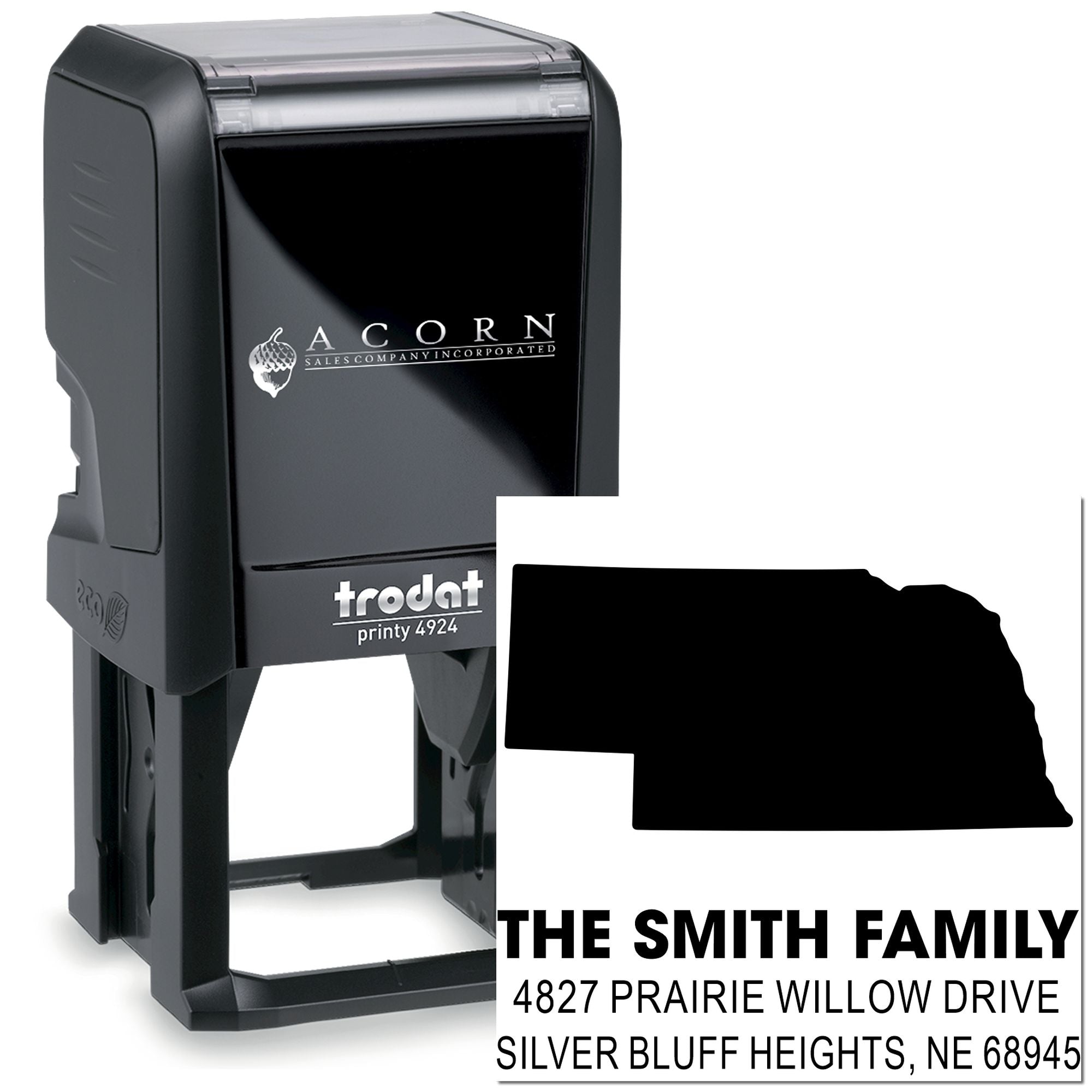 Custom self-inking rubber address stamp with family name, Nebraska outline, and return address for mailing.